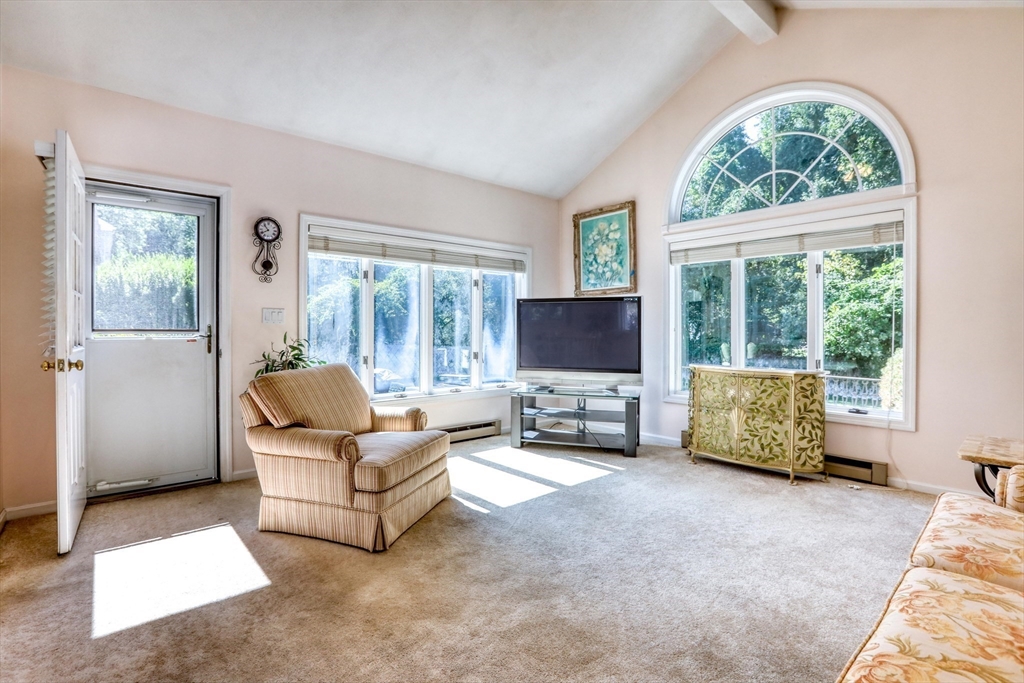 22 Crosby Street Stoneham, MA 02180 - Photo 11 of 30 a living room with furniture and a flat screen tv