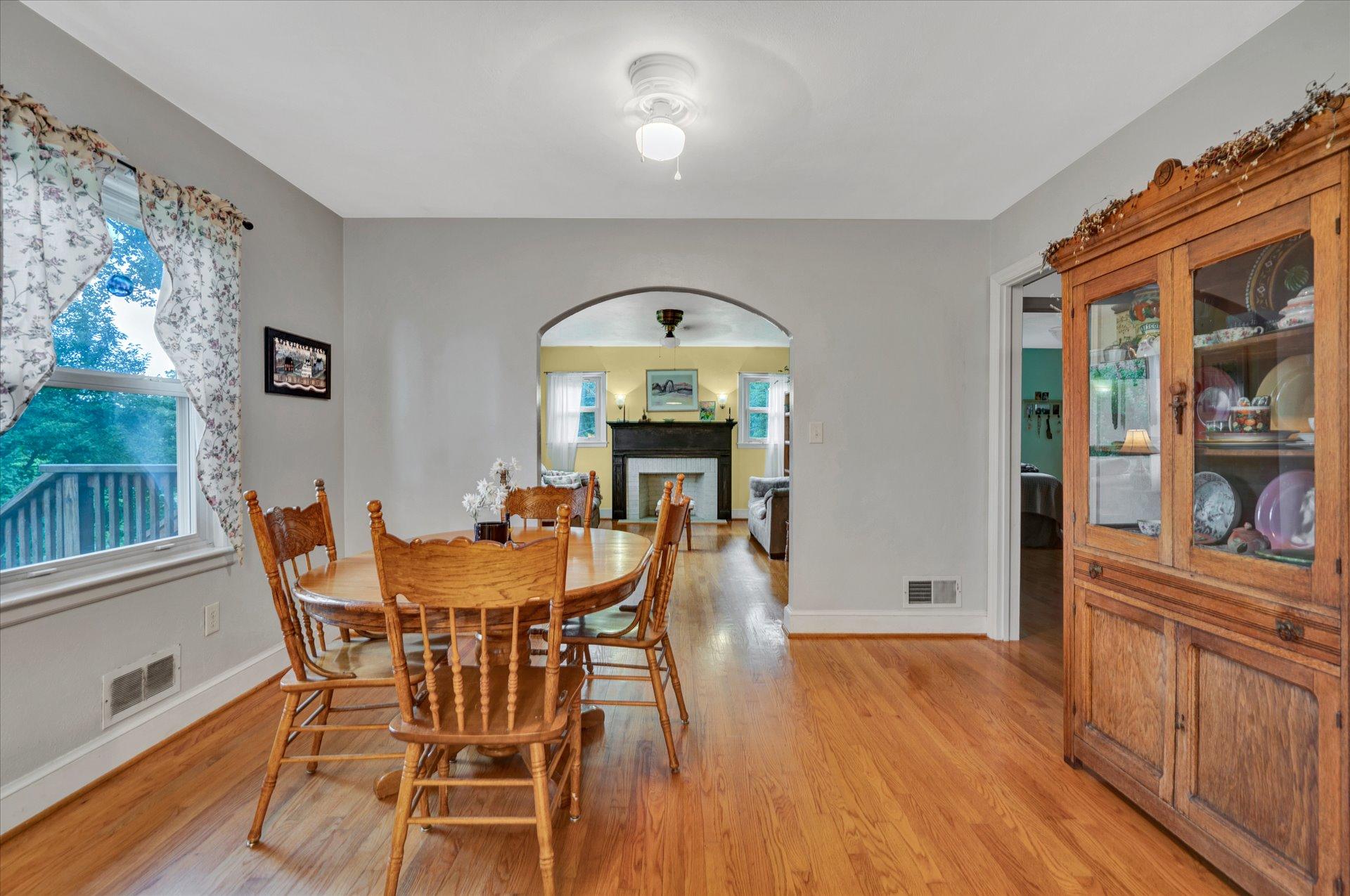 6298 Saunders Road Vinton, VA 24179 - Photo 2 of 31 a view of a dining room with furniture chandelier and wooden floor