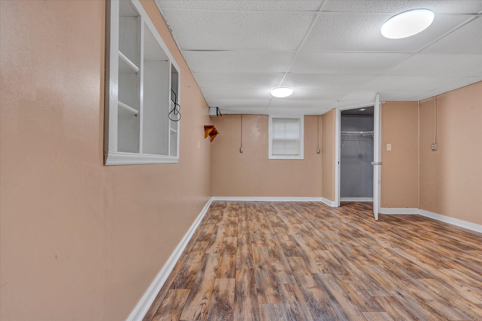 6298 Saunders Road Vinton, VA 24179 - Photo 17 of 31 a view of an empty room with wooden floor and a window
