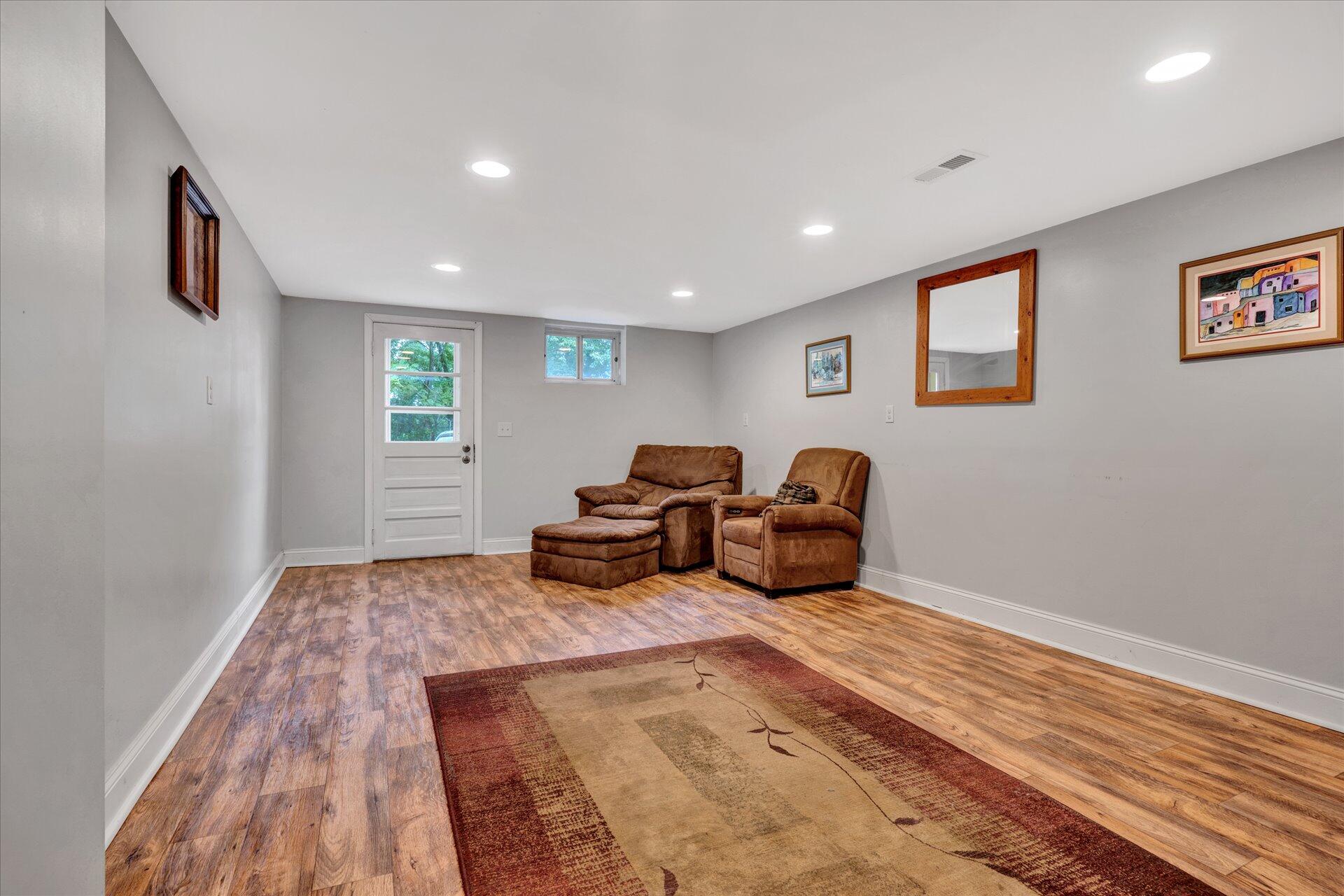 6298 Saunders Road Vinton, VA 24179 - Photo 18 of 31 a living room with furniture a couch and a rug