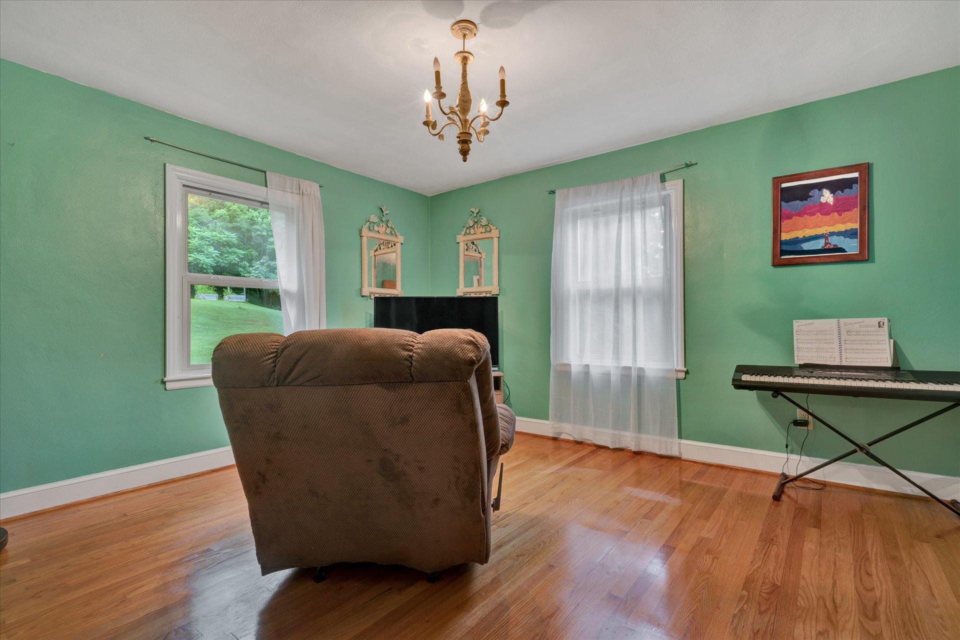 6298 Saunders Road Vinton, VA 24179 - Photo 20 of 31 a living room with window and a wooden floor