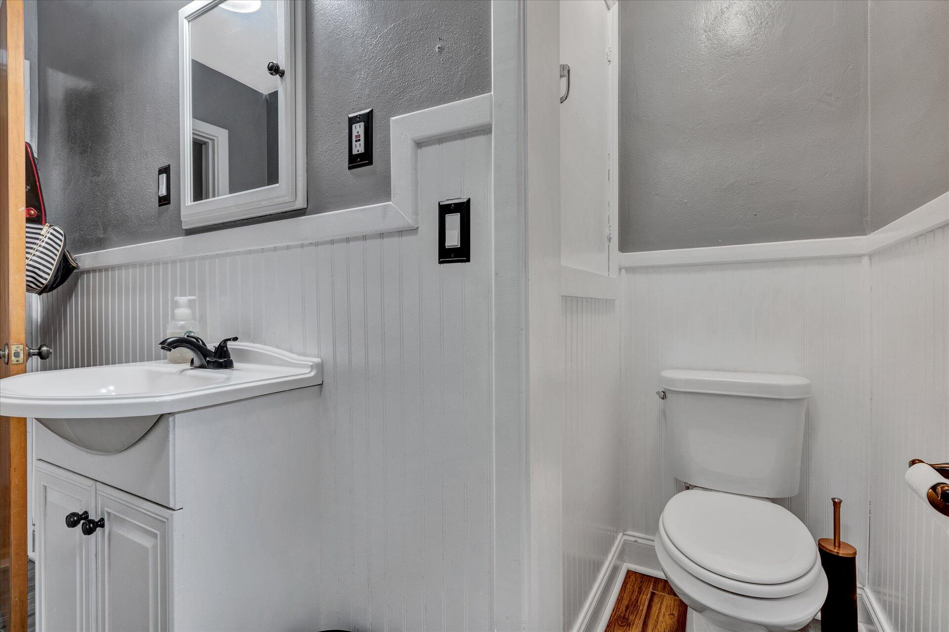 6298 Saunders Road Vinton, VA 24179 - Photo 21 of 31 a bathroom with a sink a toilet and mirror