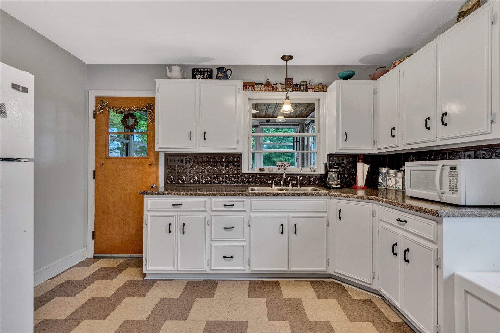 6298 Saunders Road Vinton, VA 24179 - Photo 27 of 31 a kitchen with stainless steel appliances granite countertop a sink and a stove