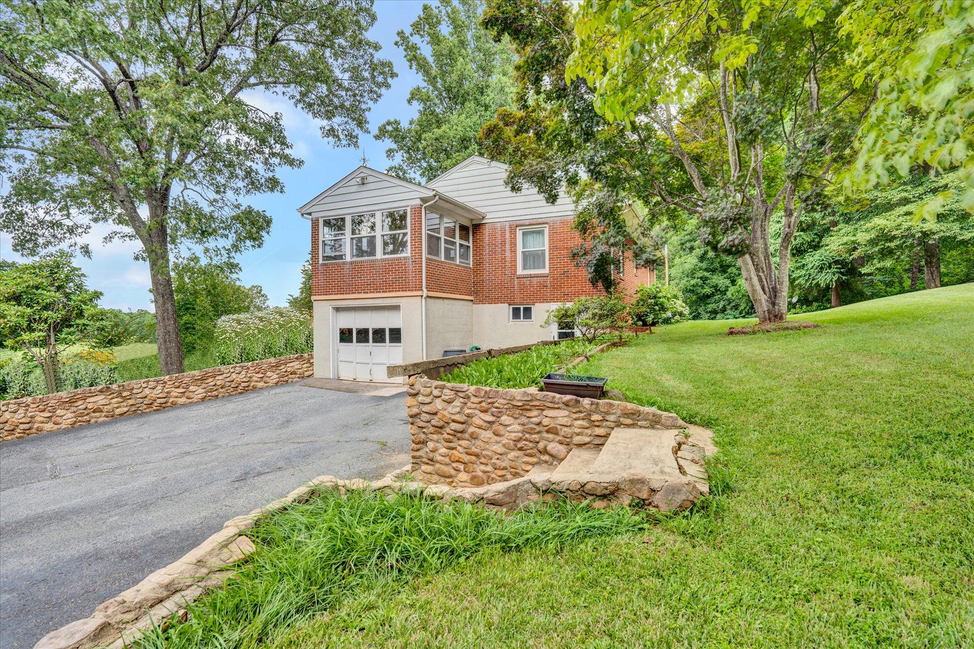 6298 Saunders Road Vinton, VA 24179 - Photo 30 of 31 a front view of a house with a garden