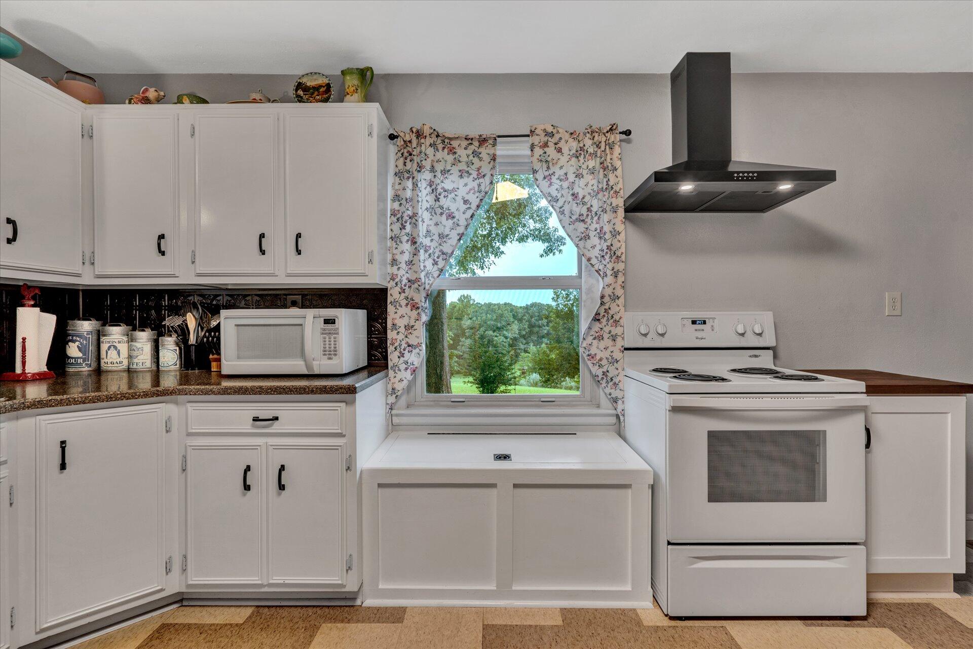 6298 Saunders Road Vinton, VA 24179 - Photo 4 of 31 a kitchen with stainless steel appliances granite countertop a stove and a white refrigerator