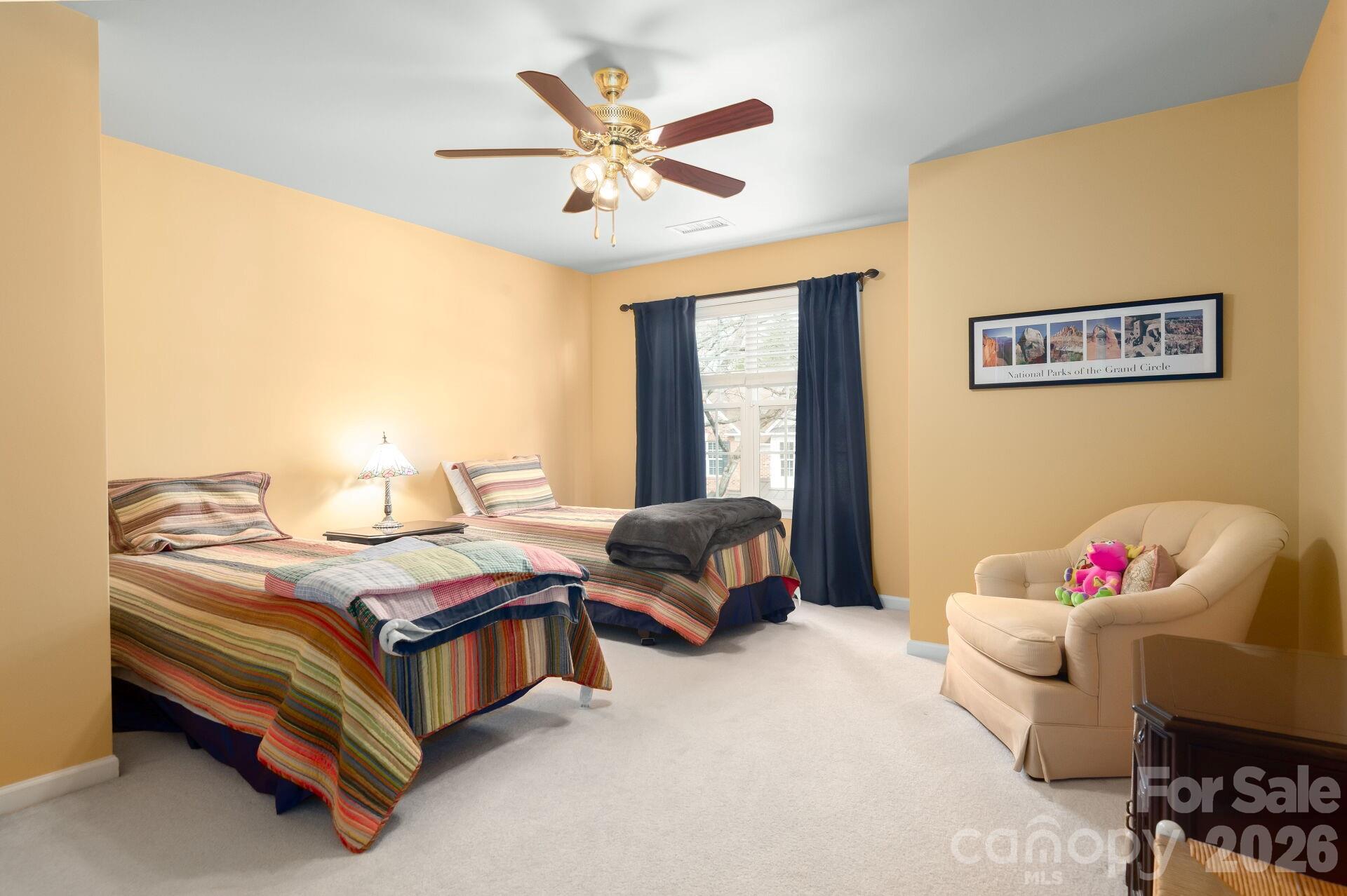 8124 Oratorio Place Charlotte, NC 28270 - Photo 26 of 38 a bedroom with a bed and a couch