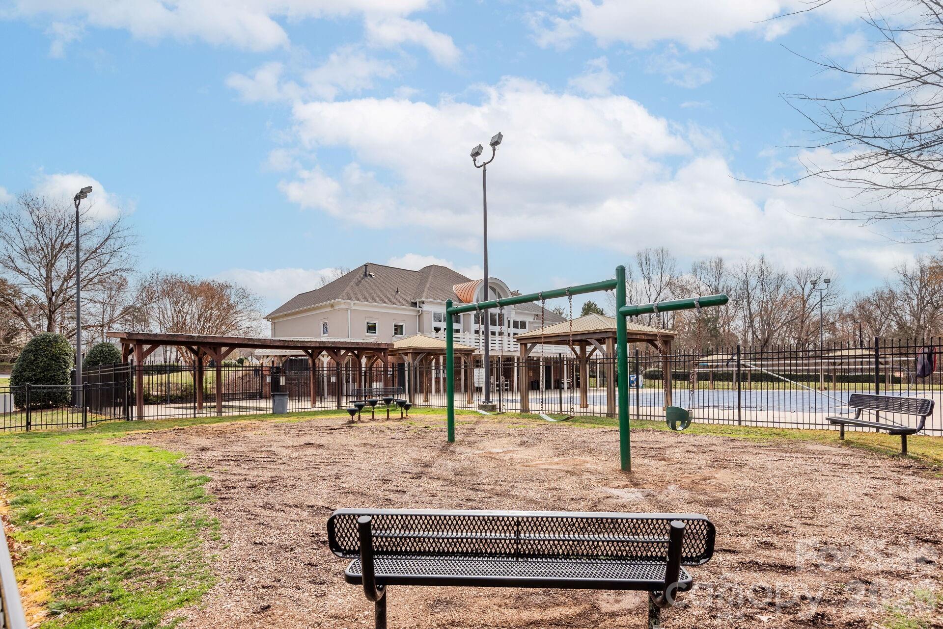 8124 Oratorio Place Charlotte, NC 28270 - Photo 36 of 38 a front view of a house with a garden