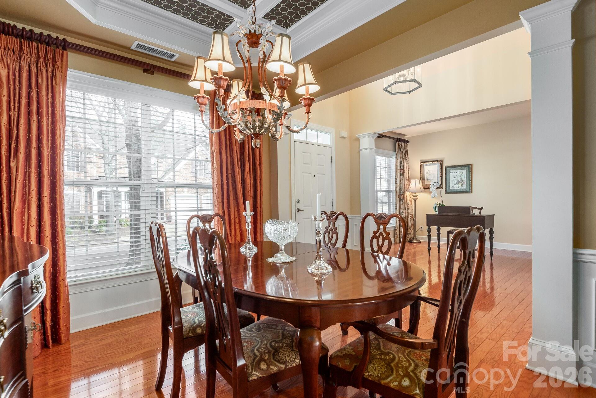 8124 Oratorio Place Charlotte, NC 28270 - Photo 6 of 38 a view of a dining room with furniture and a chandelier