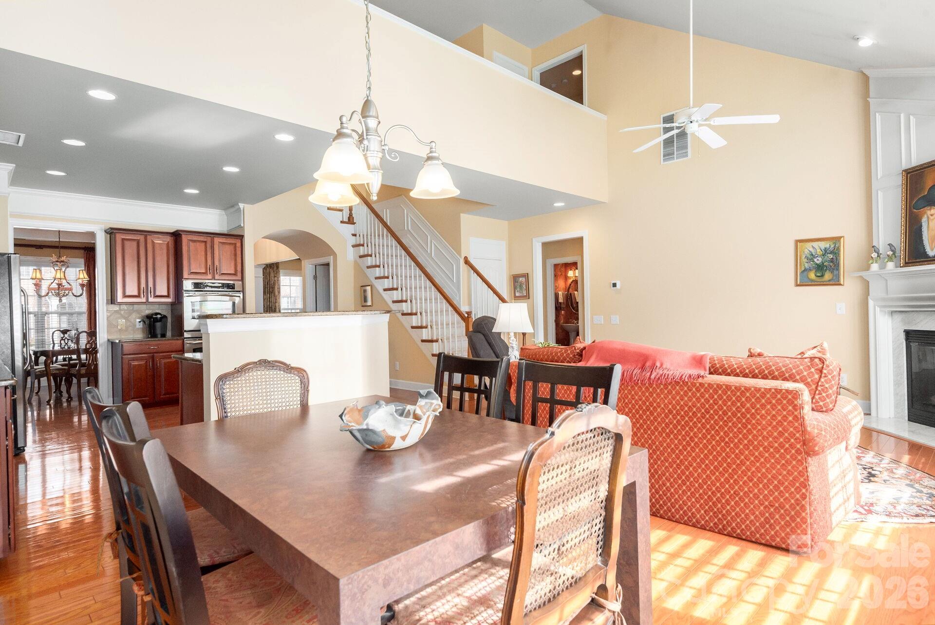 8124 Oratorio Place Charlotte, NC 28270 - Photo 7 of 38 a dining room with furniture and wooden floor