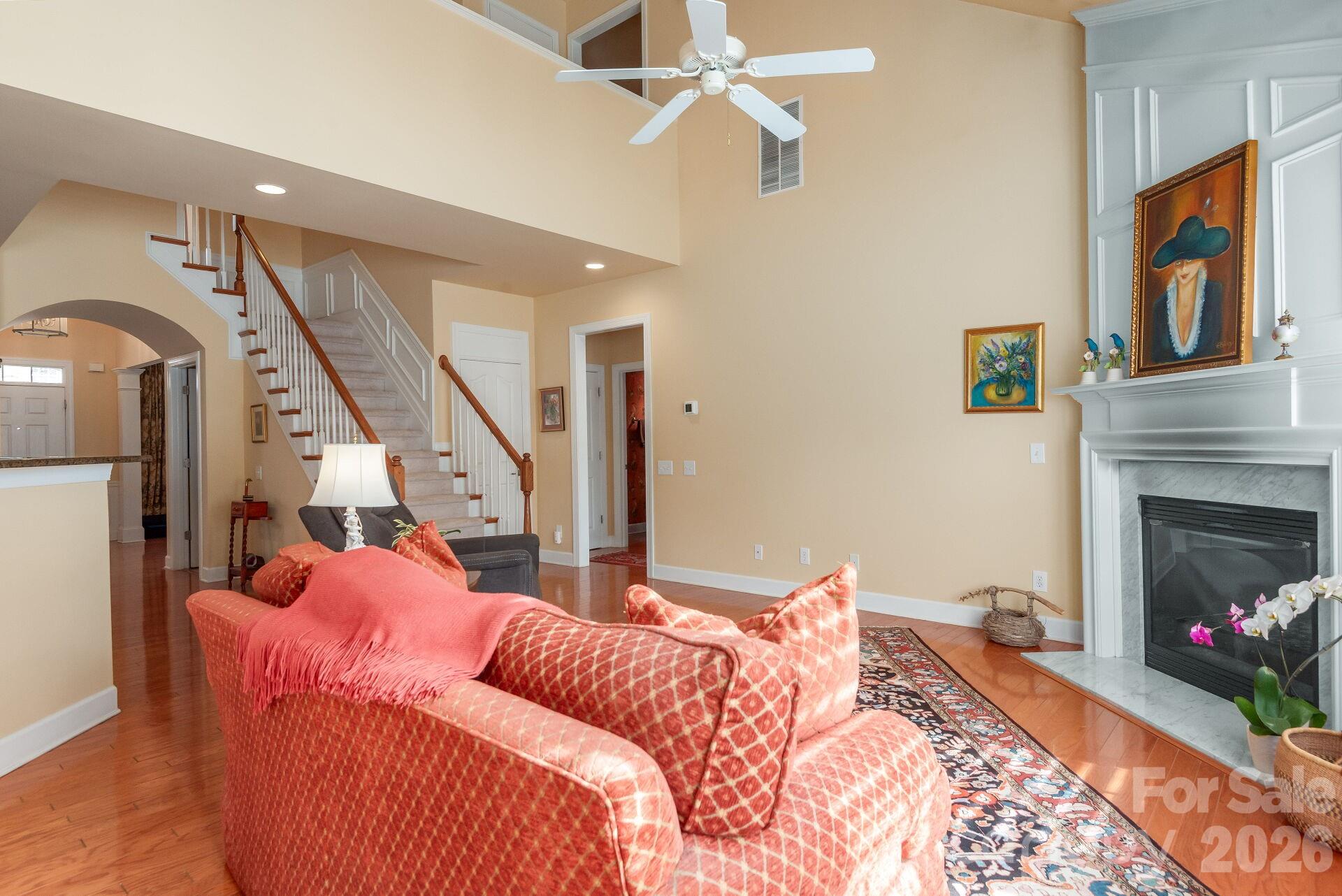 8124 Oratorio Place Charlotte, NC 28270 - Photo 8 of 38 a bed room with a bed and a fireplace