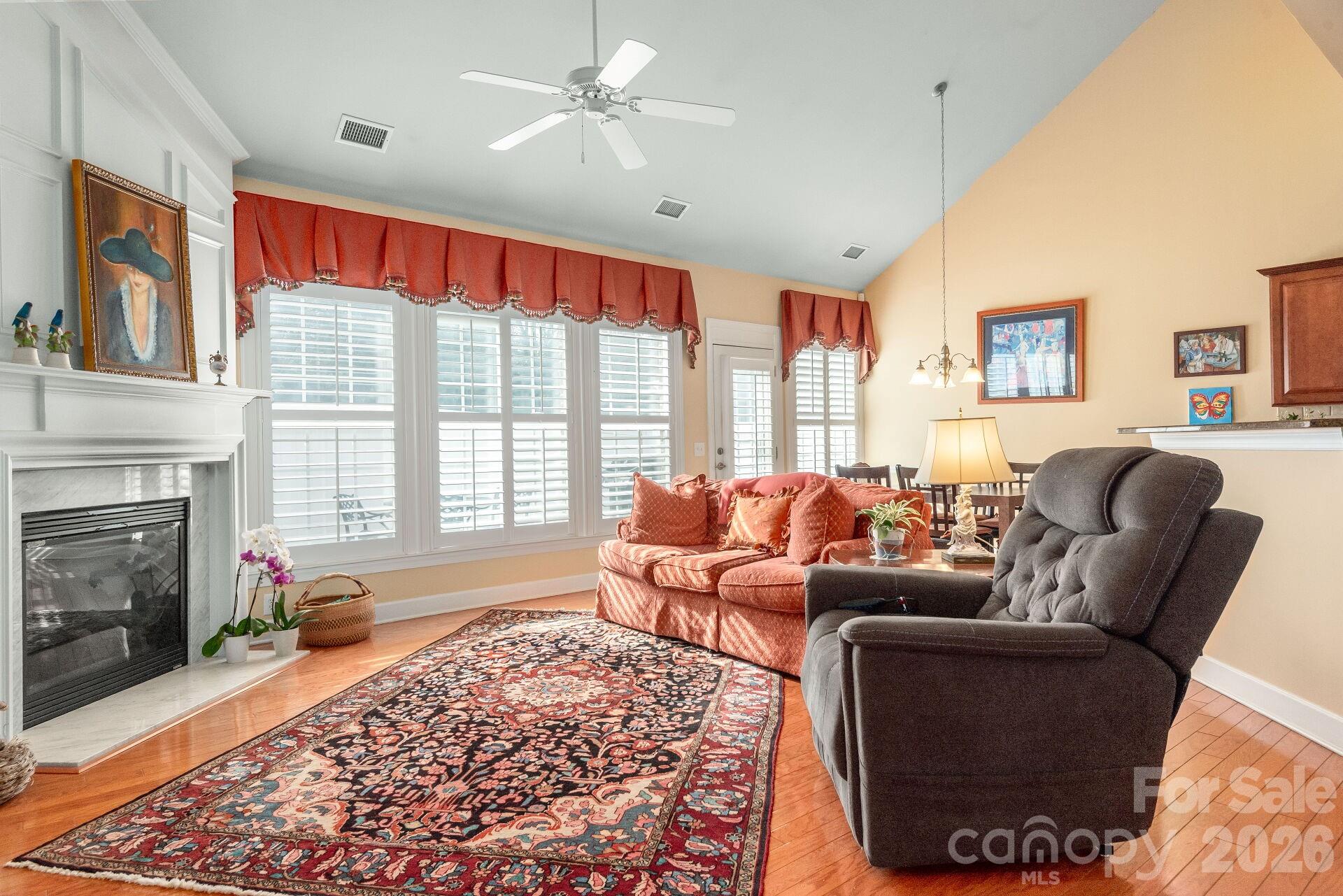 8124 Oratorio Place Charlotte, NC 28270 - Photo 9 of 38 a living room with furniture a rug and a large window