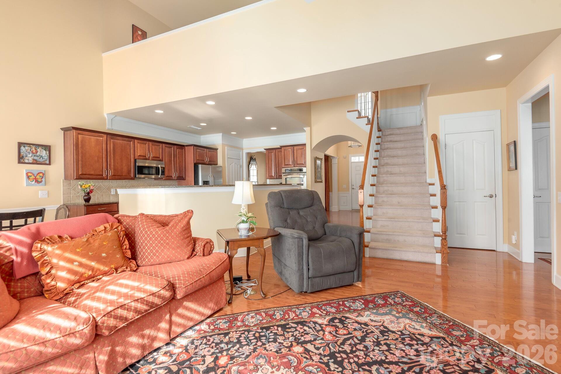 8124 Oratorio Place Charlotte, NC 28270 - Photo 10 of 38 a living room with furniture and wooden floor