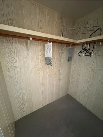 a view of storage and utility room with wooden floor