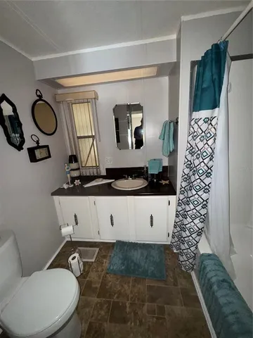 a utility room with multiple dryer and washer