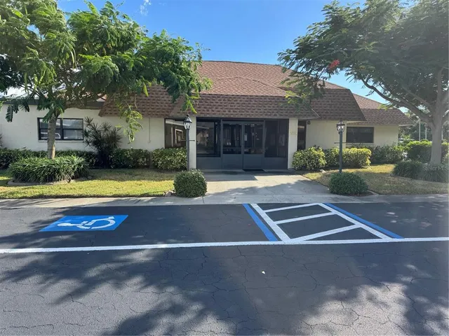 a view of a swimming pool and an outdoor seating