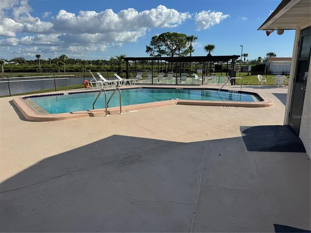 a view of building with a big yard