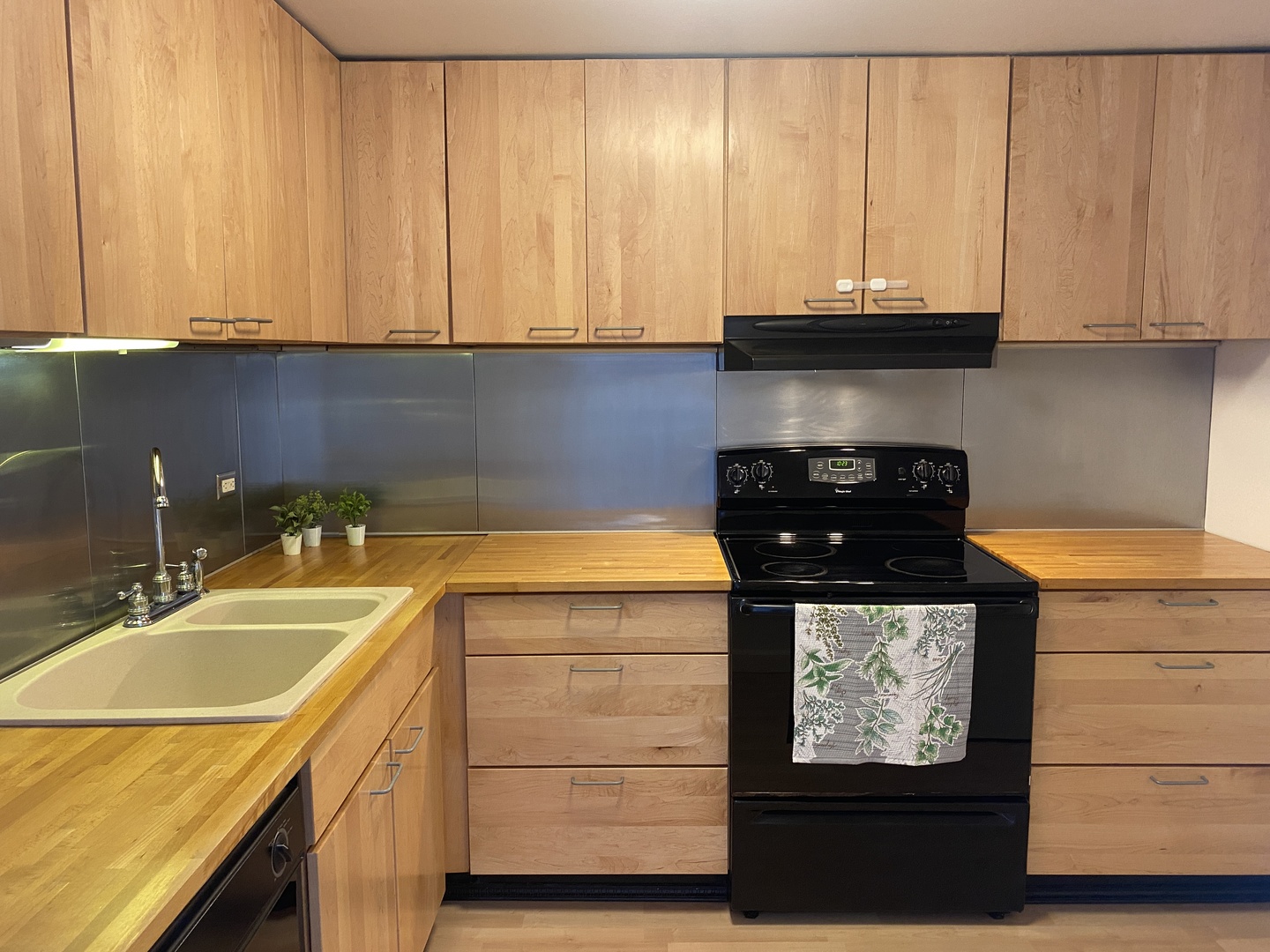 2015 South Finley Road, Unit 1101 Lombard, IL 60148 - Photo 5 of 24 a kitchen with a sink and cabinets