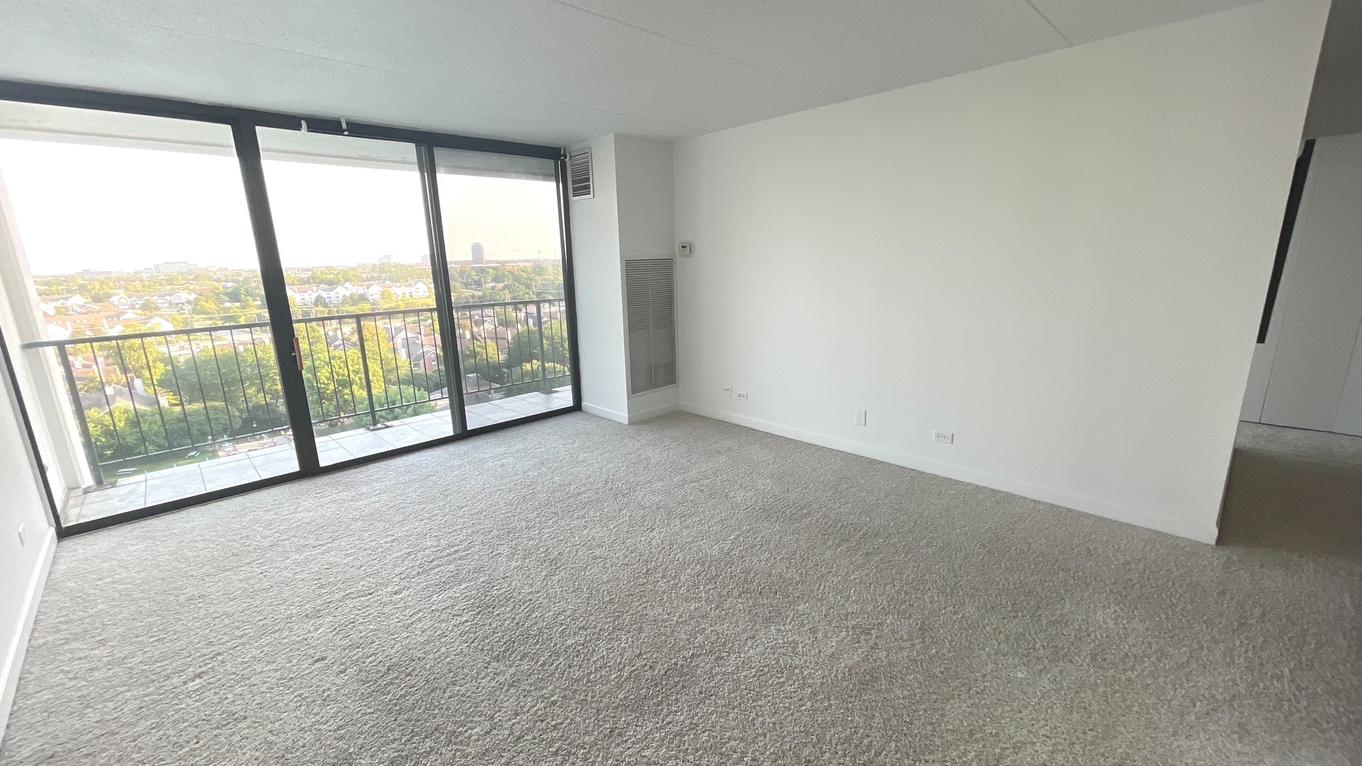 2015 South Finley Road, Unit 1101 Lombard, IL 60148 - Photo 7 of 24 an empty room with large windows