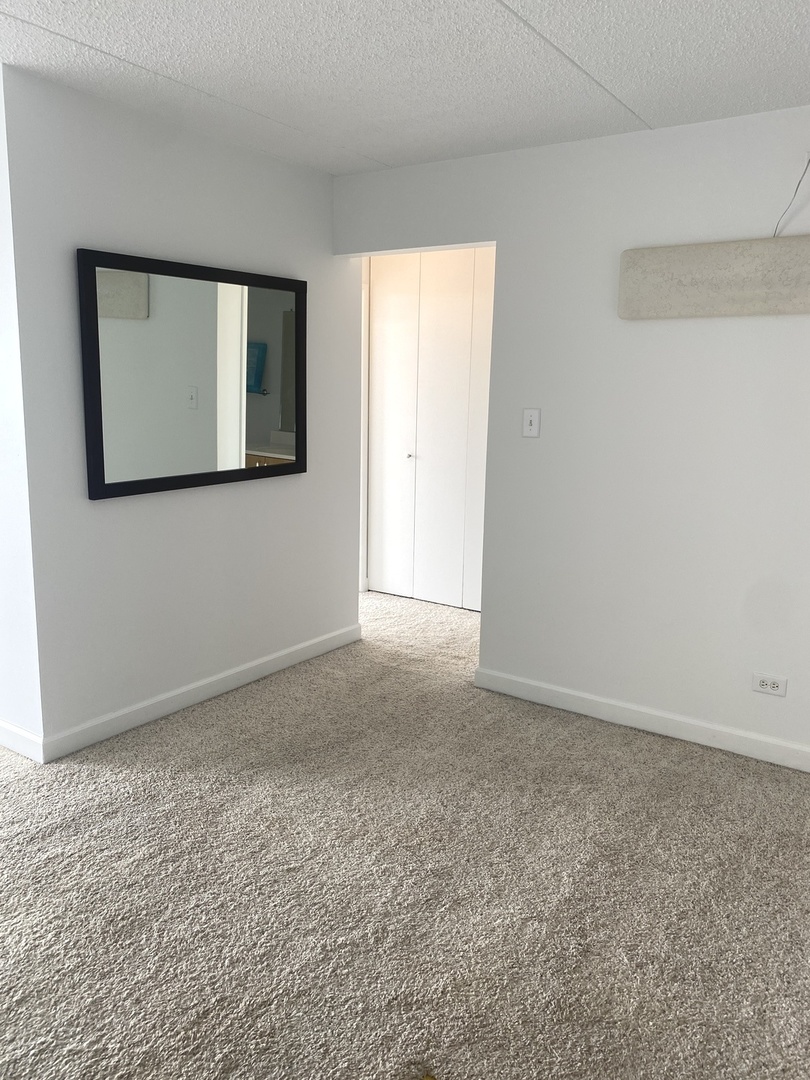 2015 South Finley Road, Unit 1101 Lombard, IL 60148 - Photo 9 of 24 a view of an empty room with window