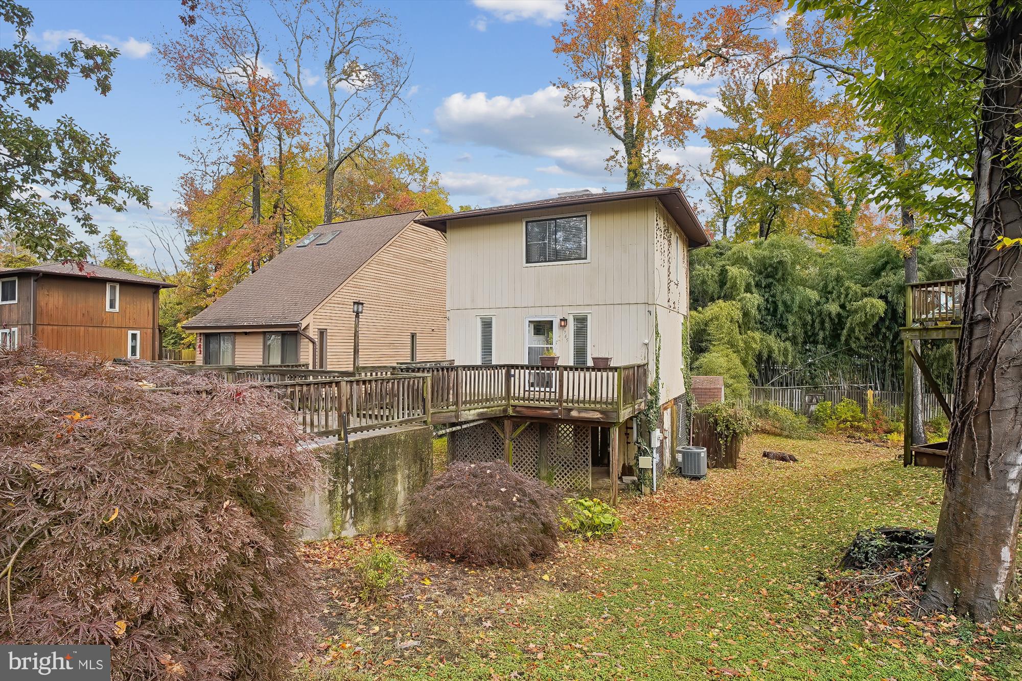 a view of a house with pool and chairs