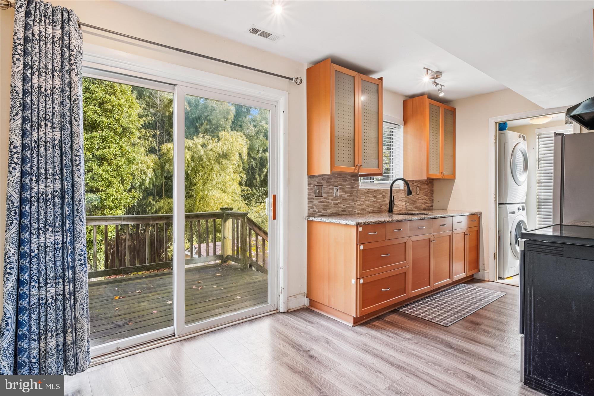 1745 Ridgely Road Edgewater, MD 21037 - Photo 11 of 43 a kitchen with stainless steel appliances granite countertop a stove a sink and a large window