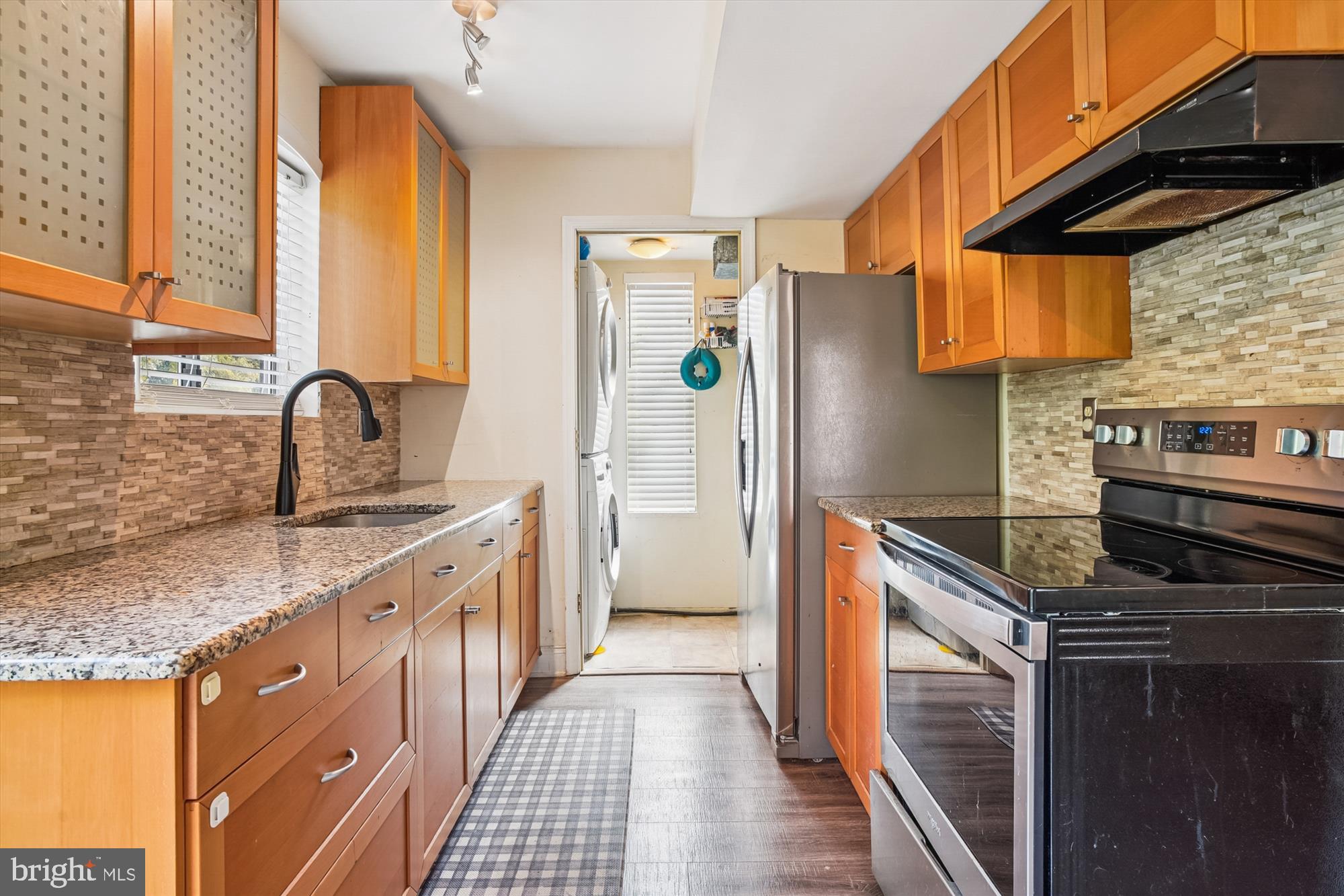 1745 Ridgely Road Edgewater, MD 21037 - Photo 13 of 43 a kitchen with stainless steel appliances granite countertop a sink stove and refrigerator