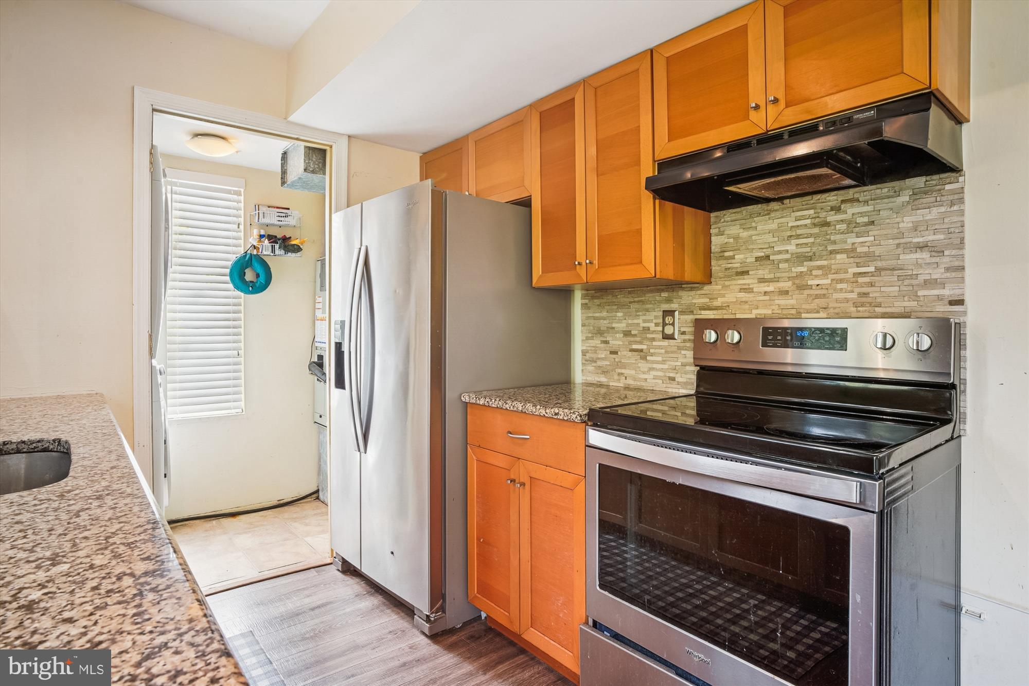 1745 Ridgely Road Edgewater, MD 21037 - Photo 14 of 43 a kitchen with stainless steel appliances and cabinets