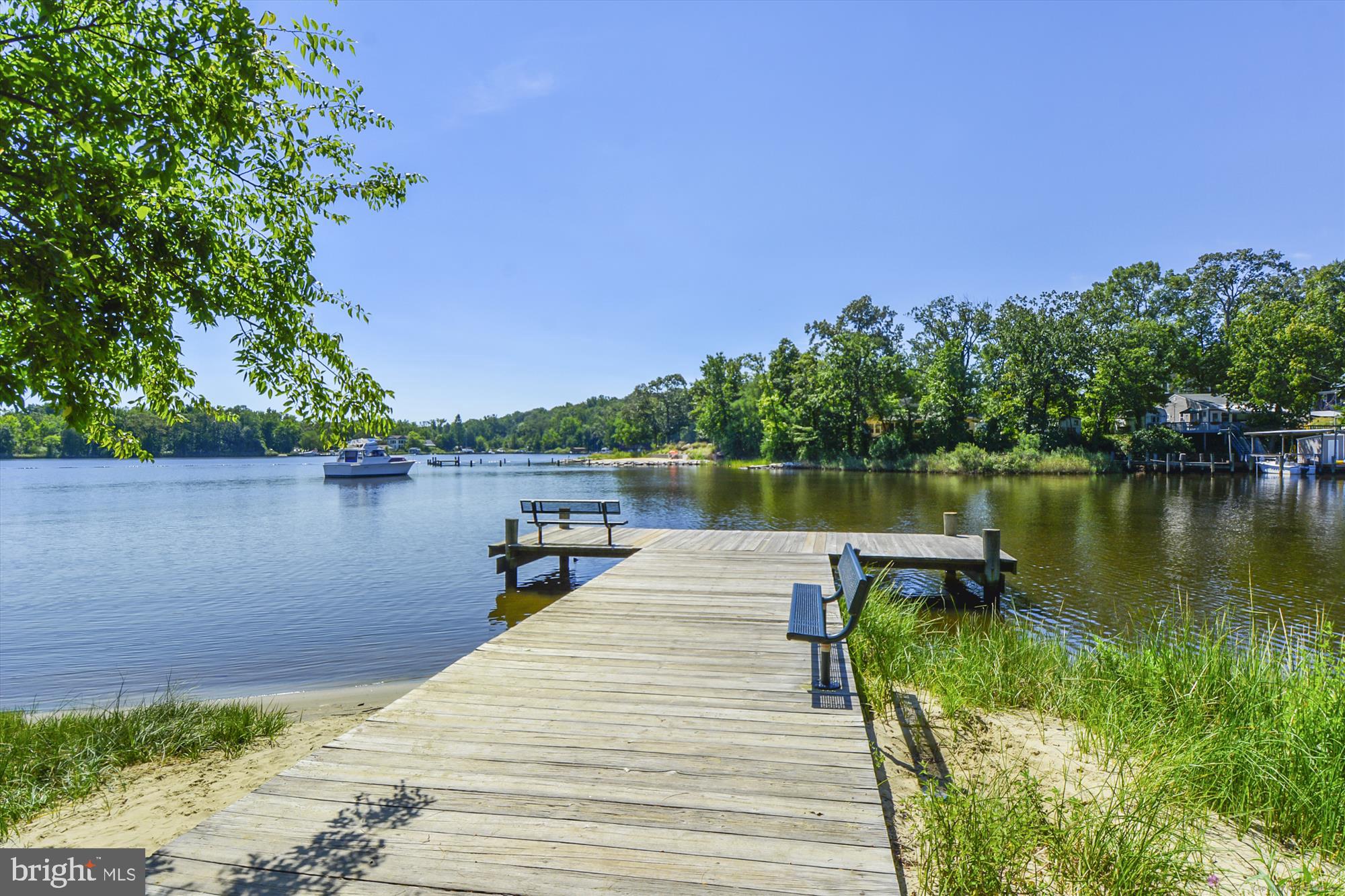 1745 Ridgely Road Edgewater, MD 21037 - Photo 24 of 43 a lake view with a wooden bridge and a lake view