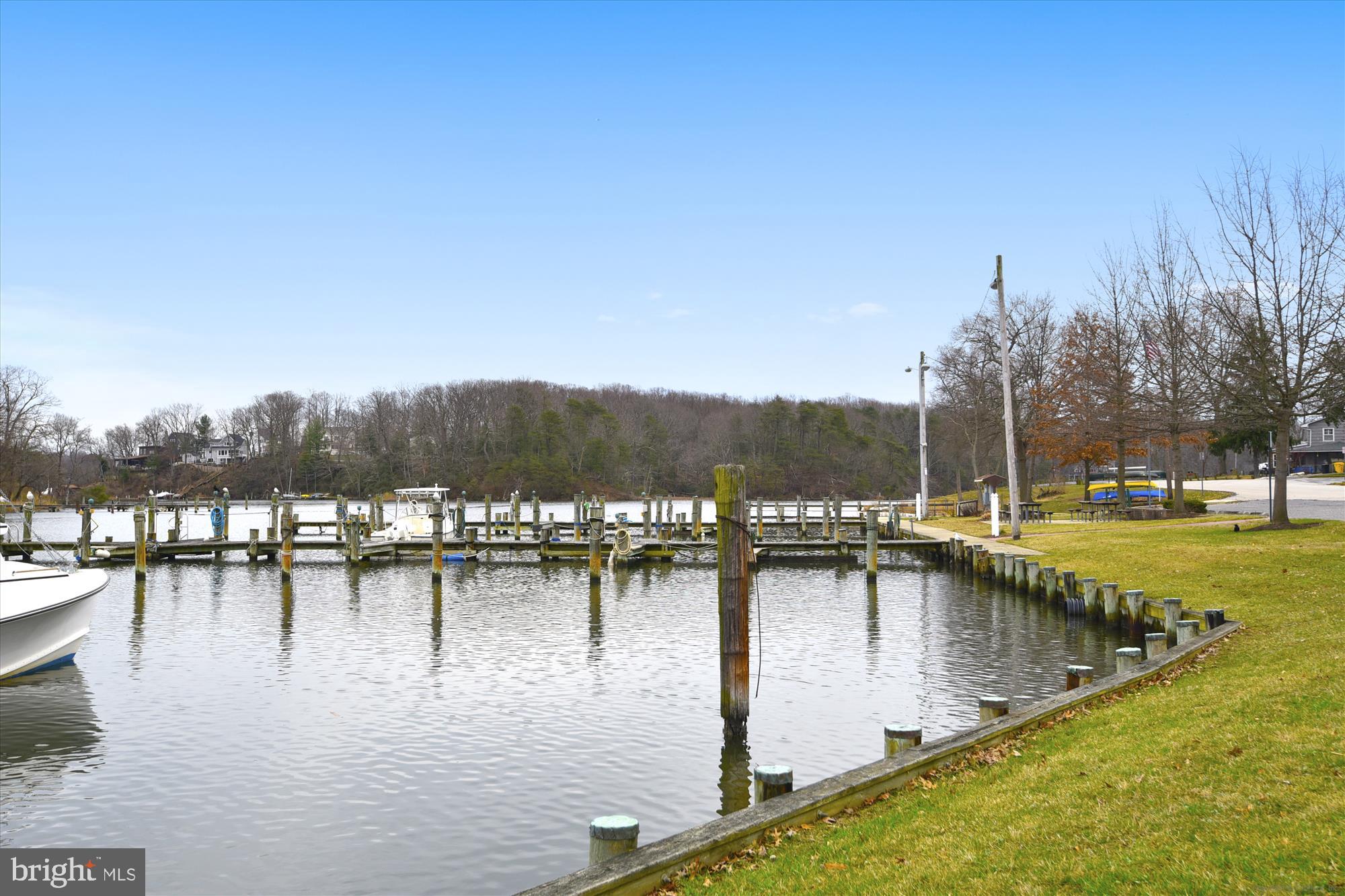 1745 Ridgely Road Edgewater, MD 21037 - Photo 39 of 43 a view of a lake with boats and trees in the background