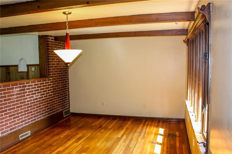 1220 Ridge Road Ambridge, PA 15003 - Photo 10 of 22 What had previously been a back porch/sun room was converted many years ago to a large dining area right off of the kitchen.