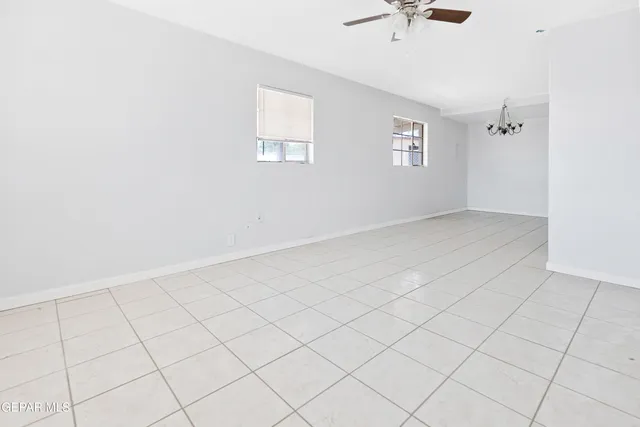 a view of an empty room and a window