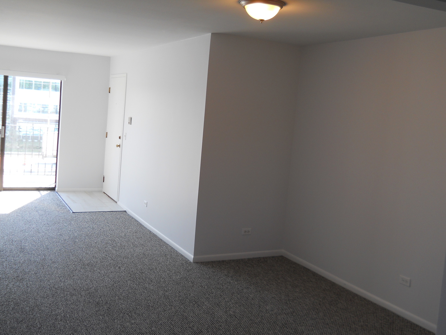 104 Steeple Drive, Unit F Buffalo Grove, IL 60089 - Photo 3 of 11 an empty room with a window
