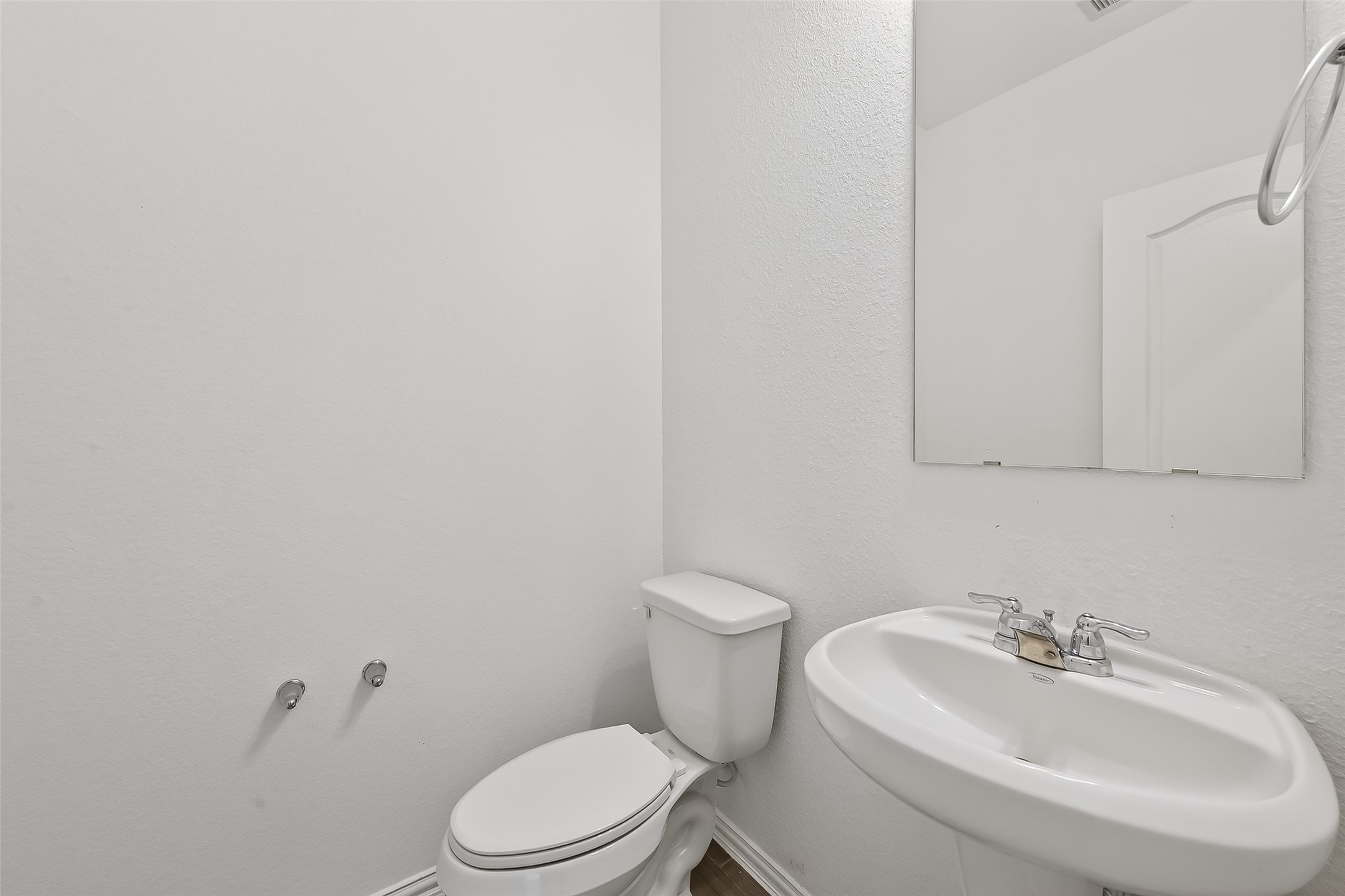 31215 Conover Drive Fulshear, TX 77441 - Photo 11 of 42 a white toilet sitting next to a white sink