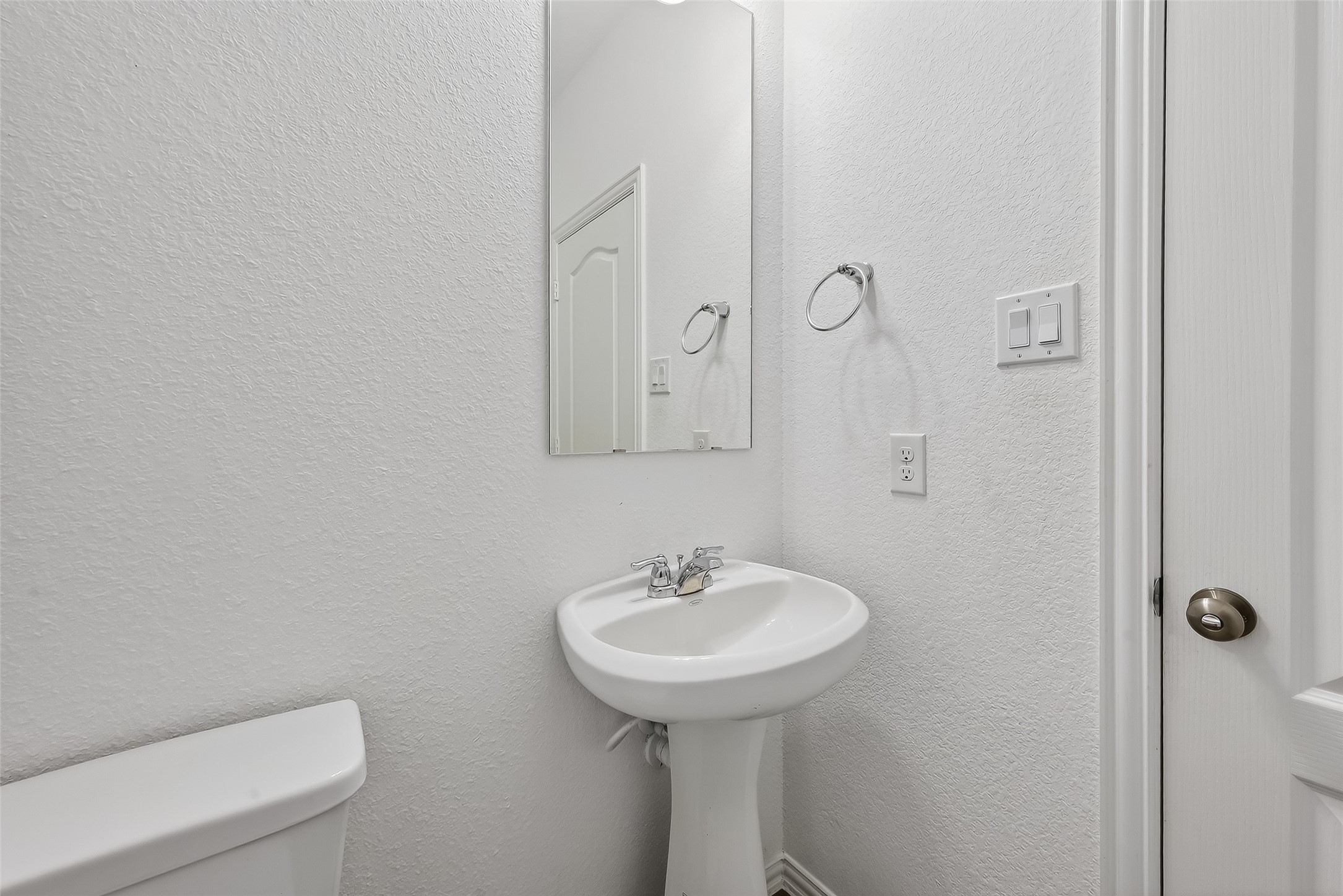 31215 Conover Drive Fulshear, TX 77441 - Photo 12 of 42 a bathroom with a toilet sink and mirror