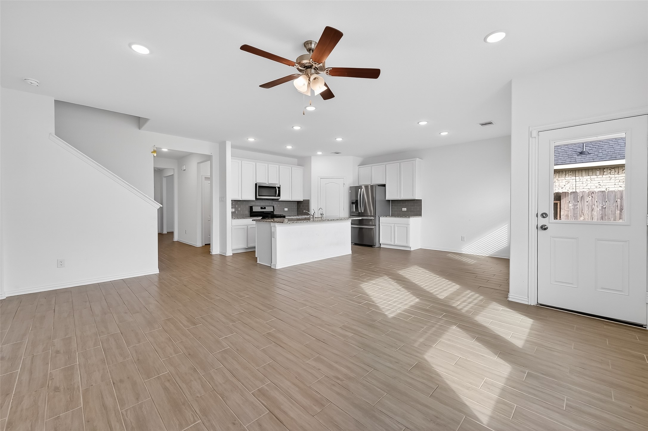 31215 Conover Drive Fulshear, TX 77441 - Photo 16 of 42 a view of kitchen with cabinets and wooden floor