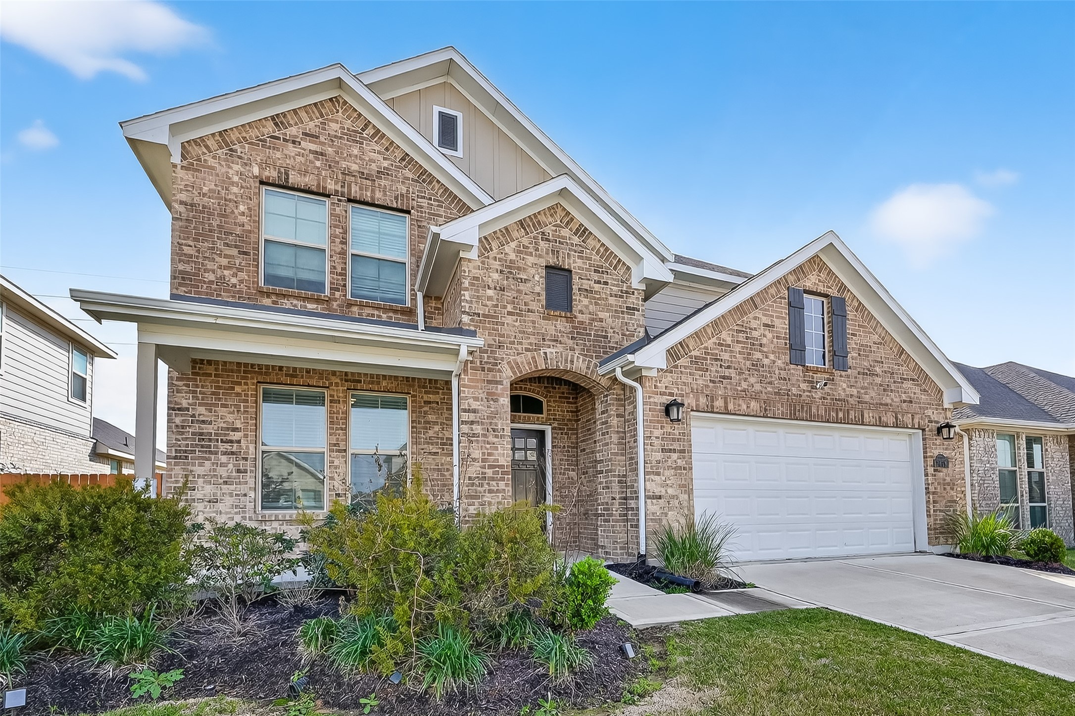 31215 Conover Drive Fulshear, TX 77441 - Photo 2 of 42 a front view of a house with garden