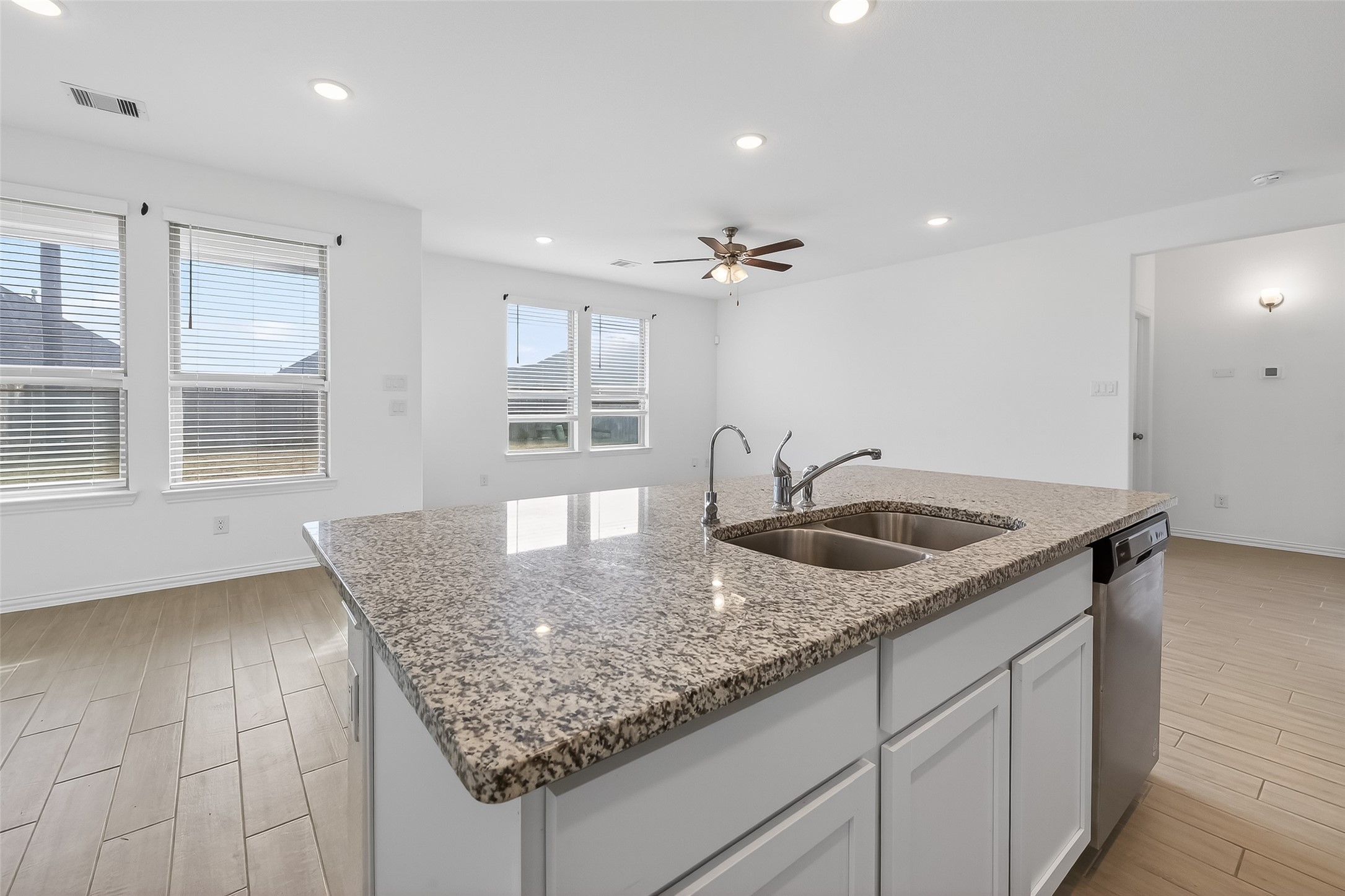 31215 Conover Drive Fulshear, TX 77441 - Photo 24 of 42 a kitchen with granite countertop a sink a counter top space and cabinets