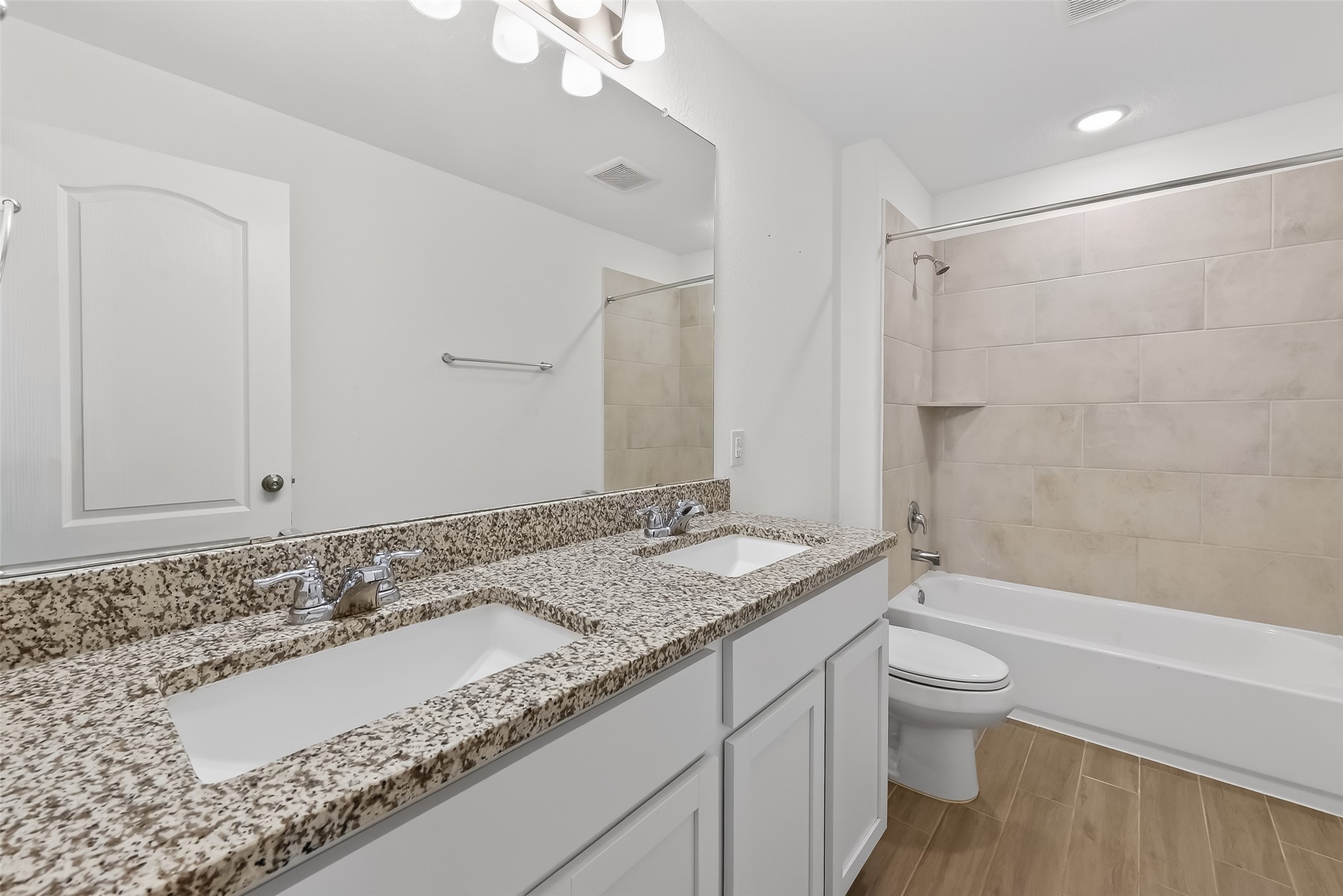 31215 Conover Drive Fulshear, TX 77441 - Photo 33 of 42 a bathroom with a granite countertop sink and a mirror