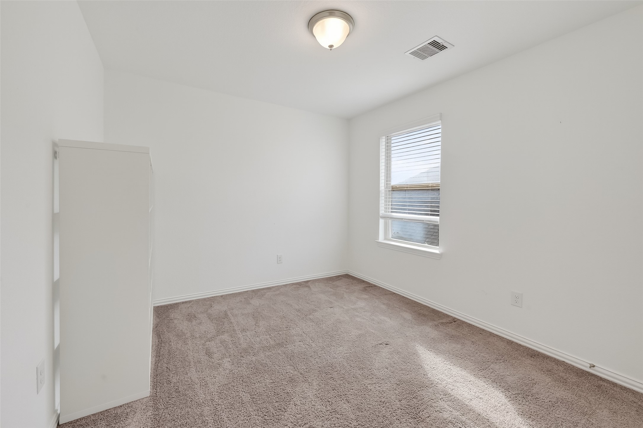 31215 Conover Drive Fulshear, TX 77441 - Photo 36 of 42 an empty room with a window