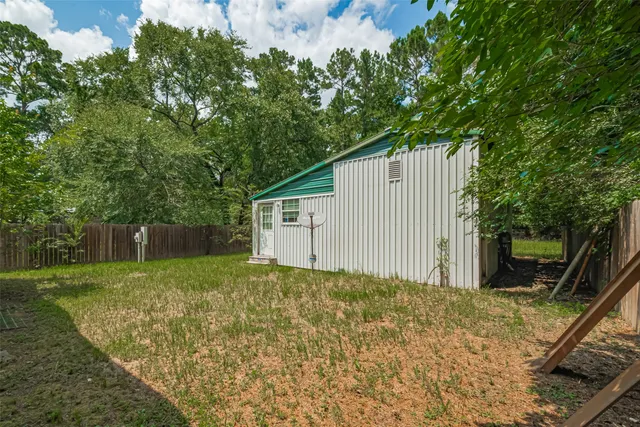 a backyard of a house with lots of green space