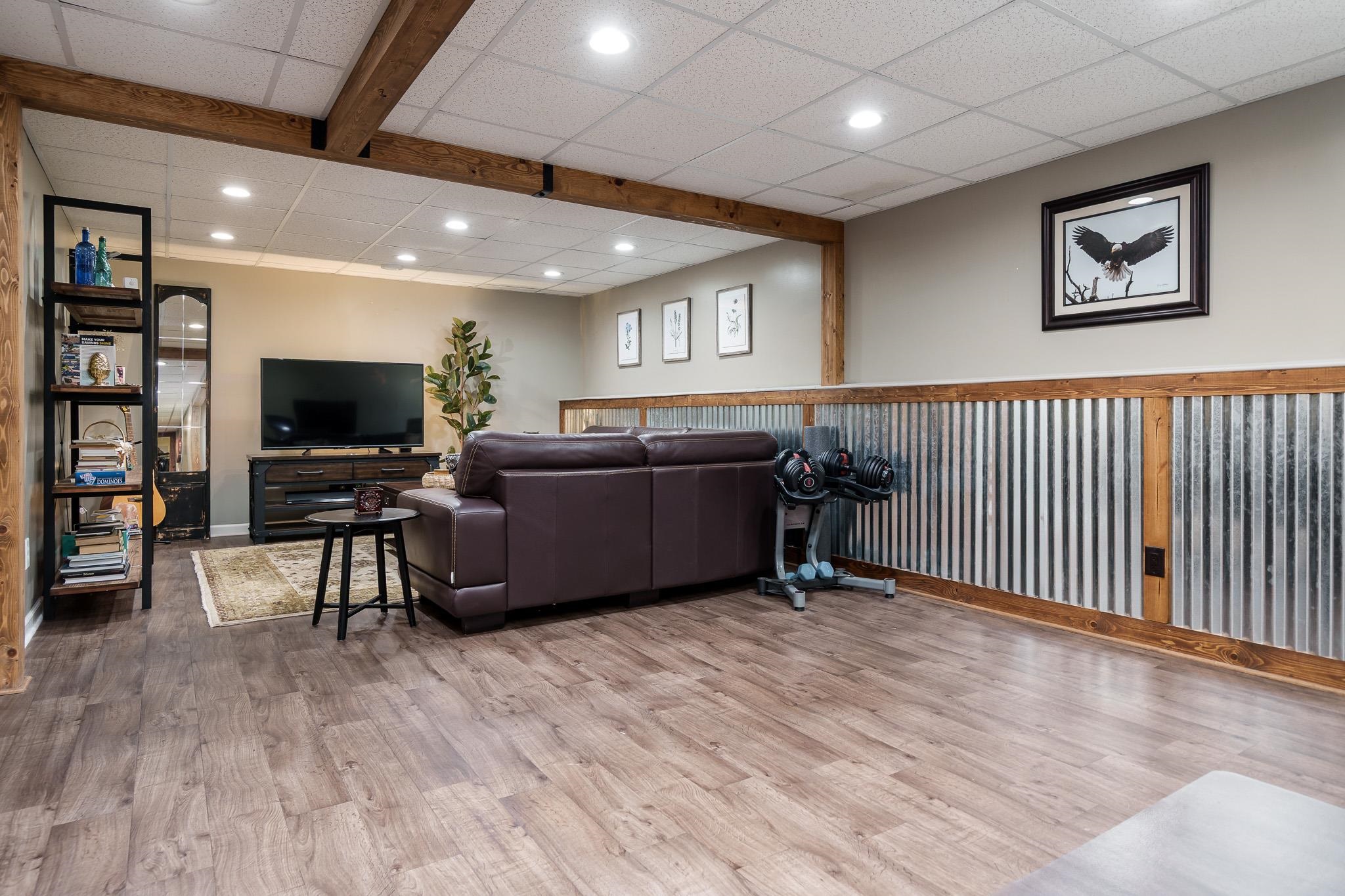 651 Genoa Street Cherry Valley, IL 61016 - Photo 18 of 70 a living room with furniture and a flat screen tv