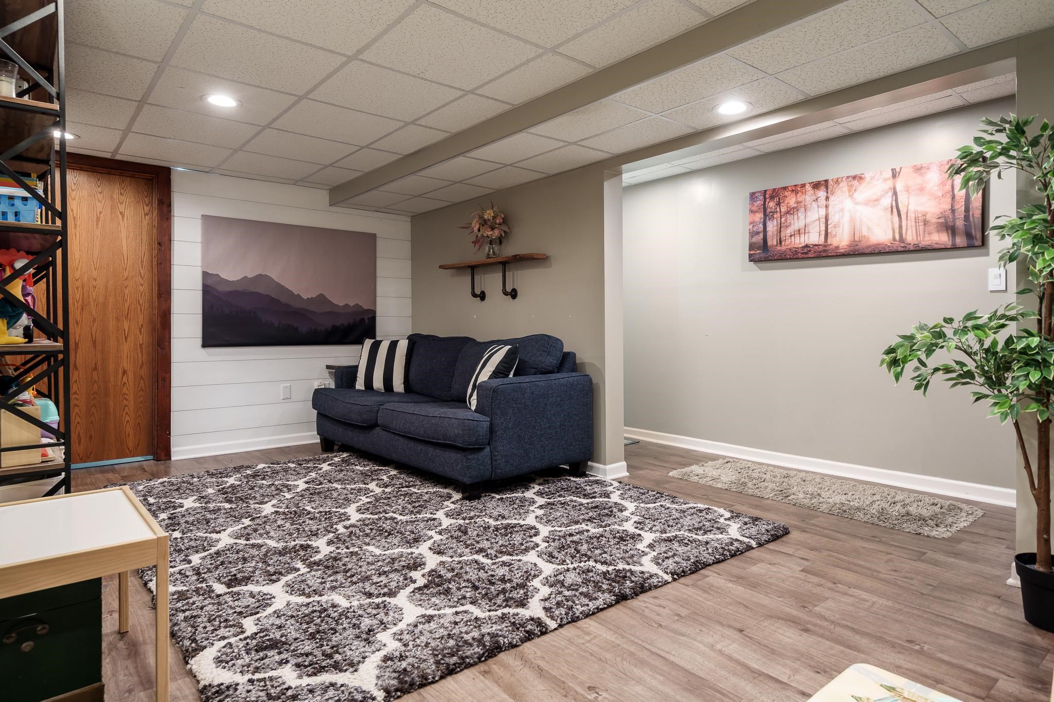 651 Genoa Street Cherry Valley, IL 61016 - Photo 2 of 70 a living room with furniture and a flat screen tv