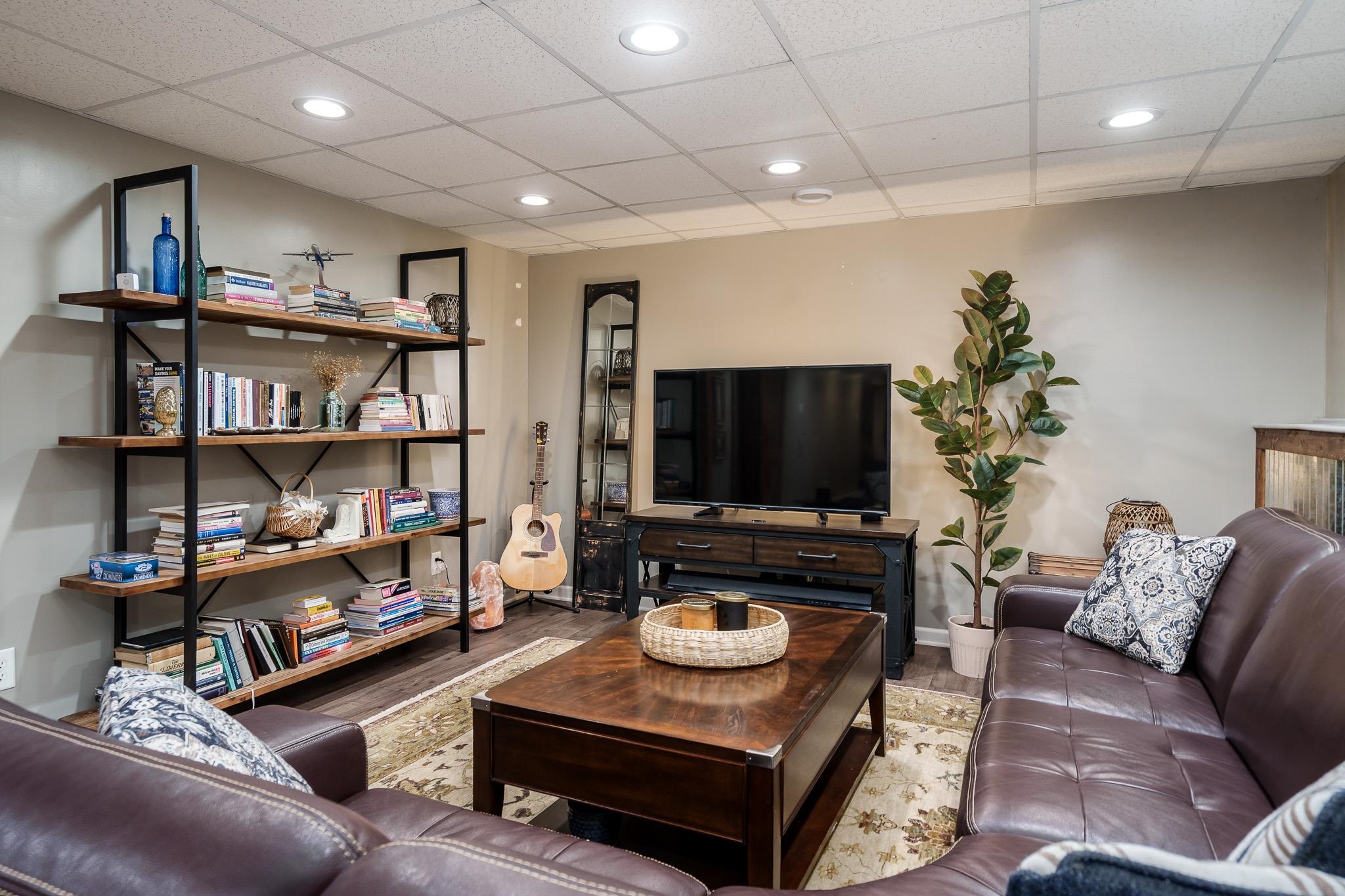 651 Genoa Street Cherry Valley, IL 61016 - Photo 21 of 70 a living room with furniture and a flat screen tv