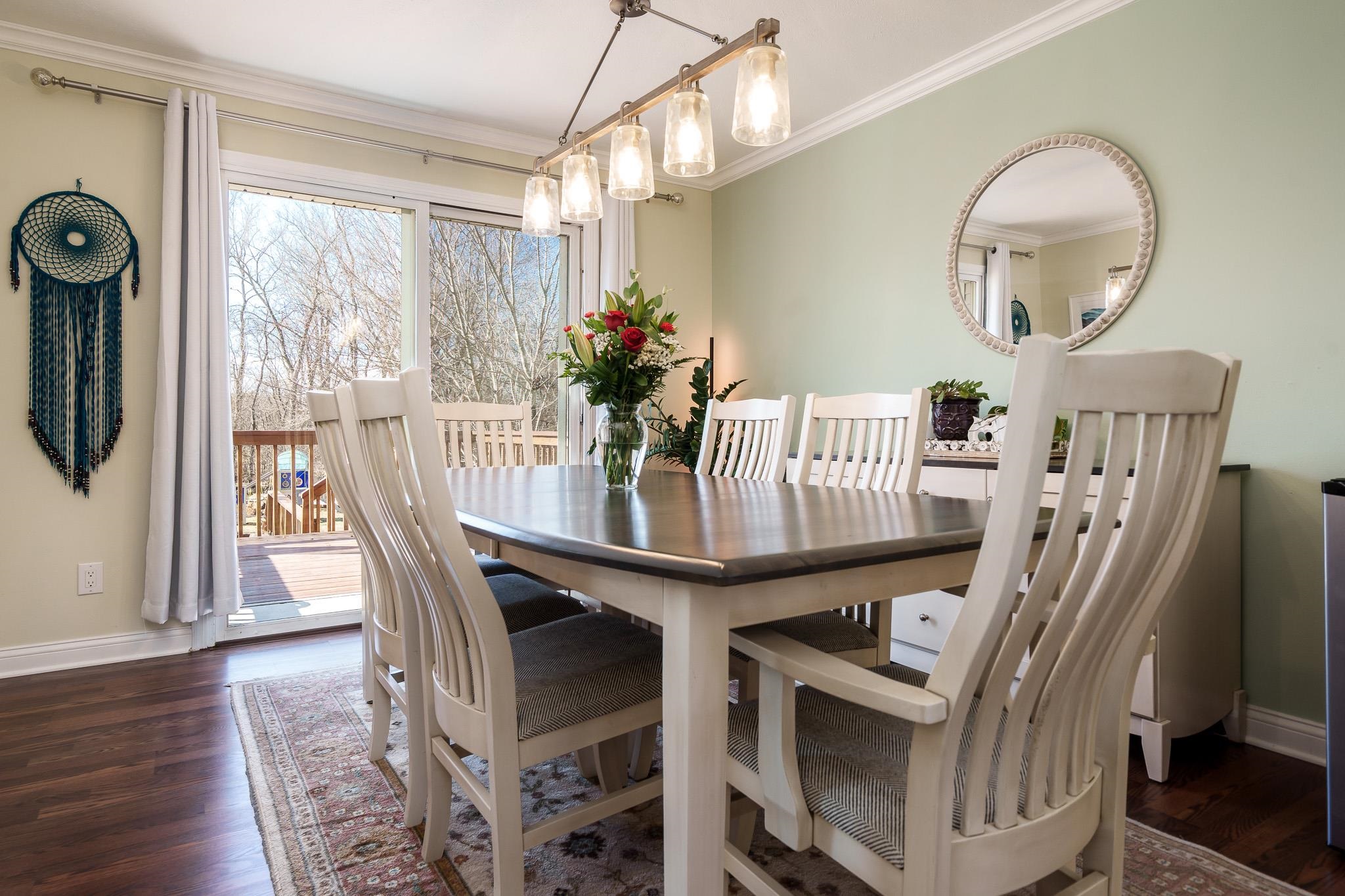 651 Genoa Street Cherry Valley, IL 61016 - Photo 33 of 70 a view of a dining room with furniture window and wooden floor