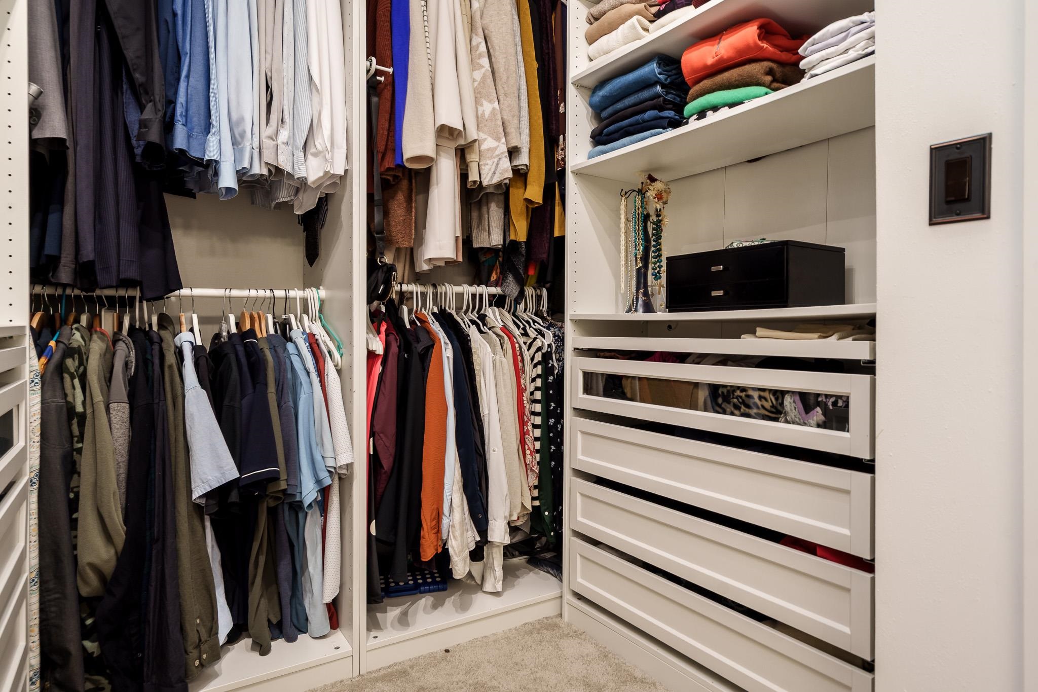651 Genoa Street Cherry Valley, IL 61016 - Photo 33 of 70 a view of walk in closet with clothes
