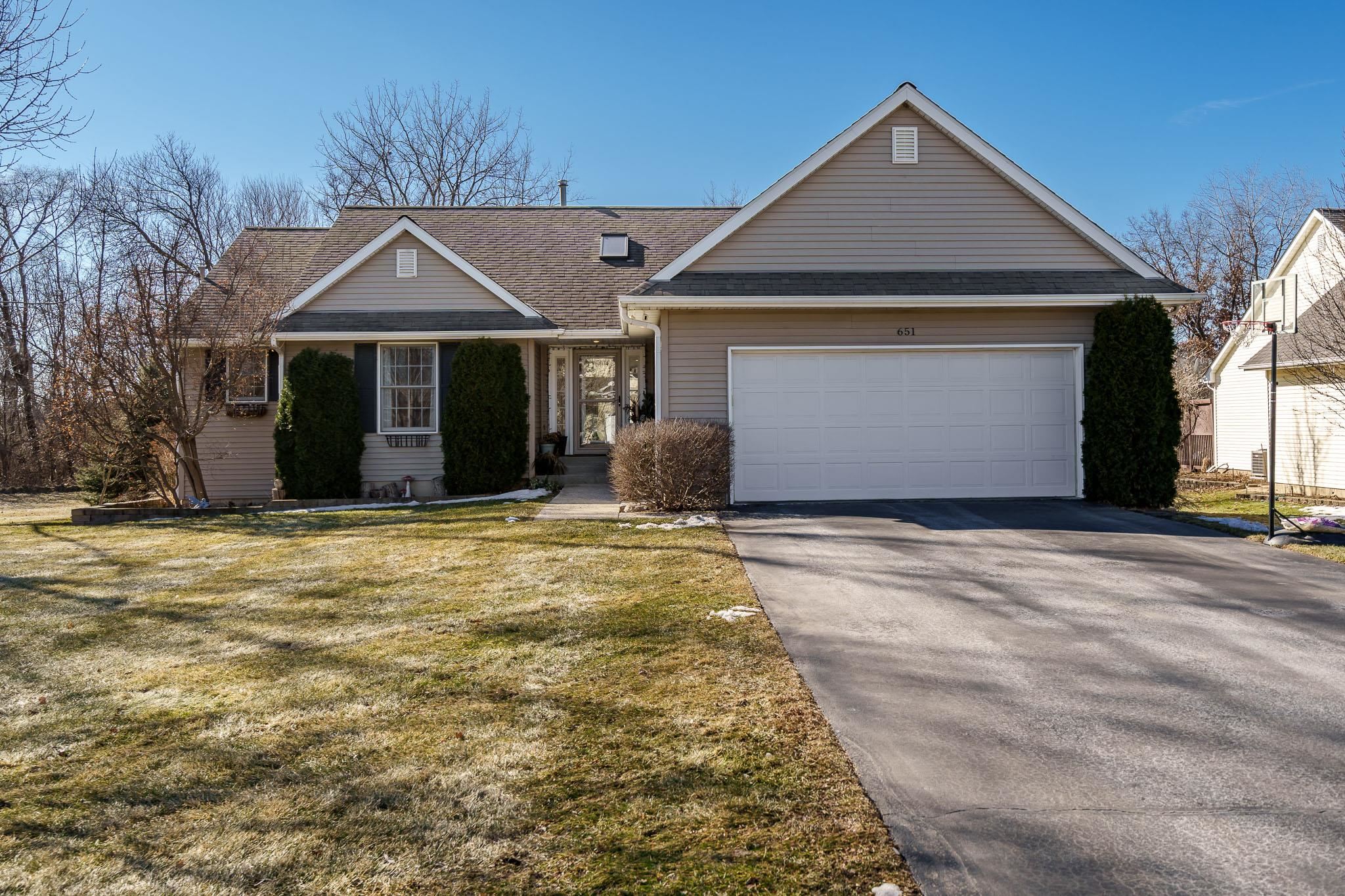 651 Genoa Street Cherry Valley, IL 61016 - Photo 35 of 70 a front view of a house with a yard