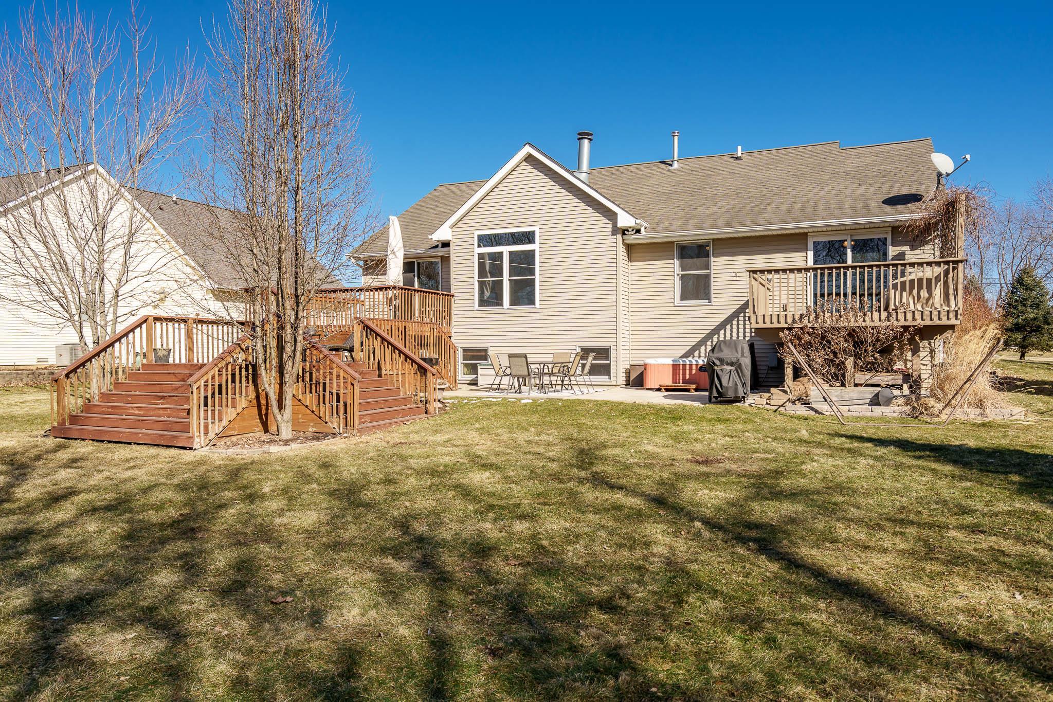 651 Genoa Street Cherry Valley, IL 61016 - Photo 50 of 70 a view of a house with a yard