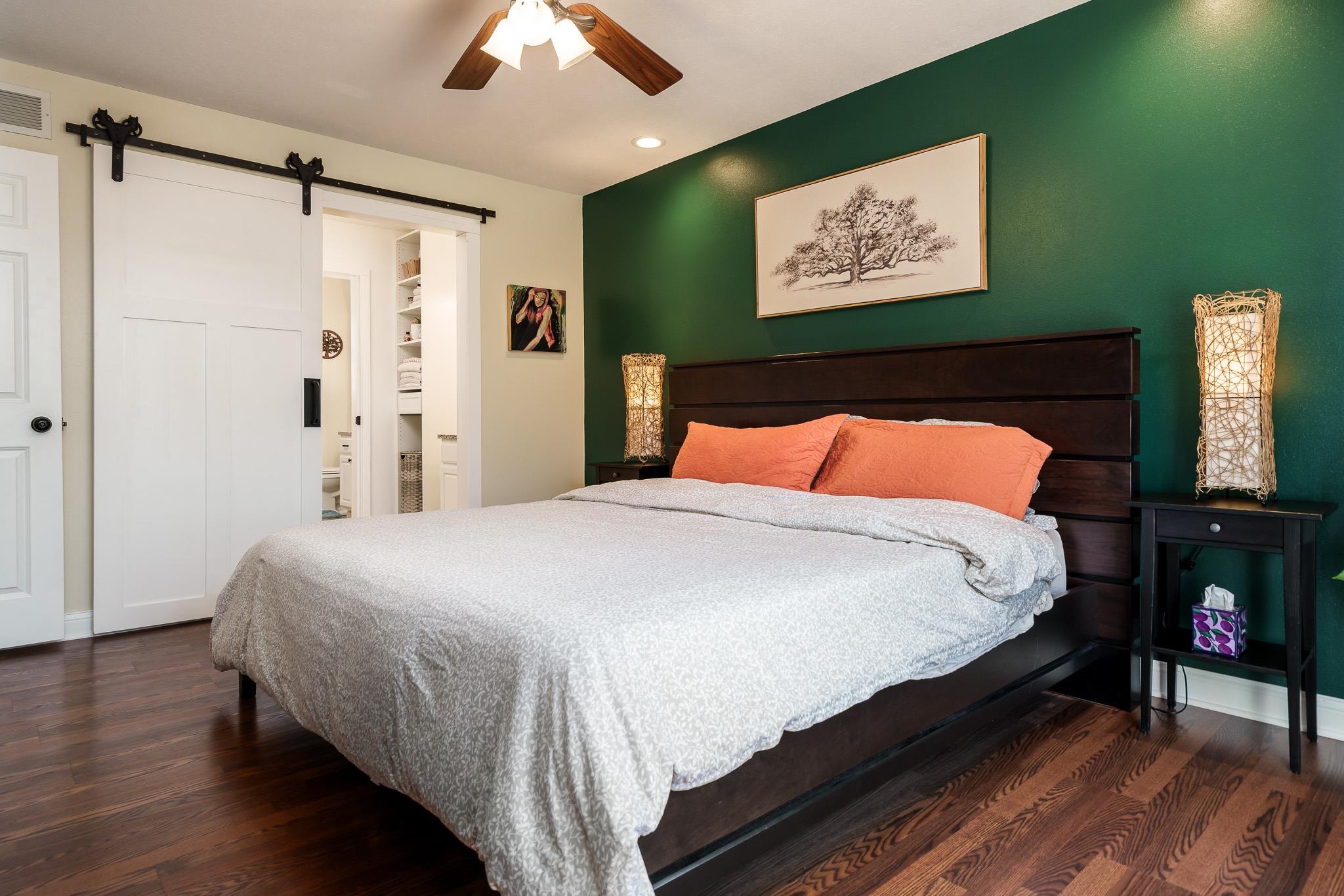651 Genoa Street Cherry Valley, IL 61016 - Photo 53 of 70 a bedroom with a bed and a painting on the wall