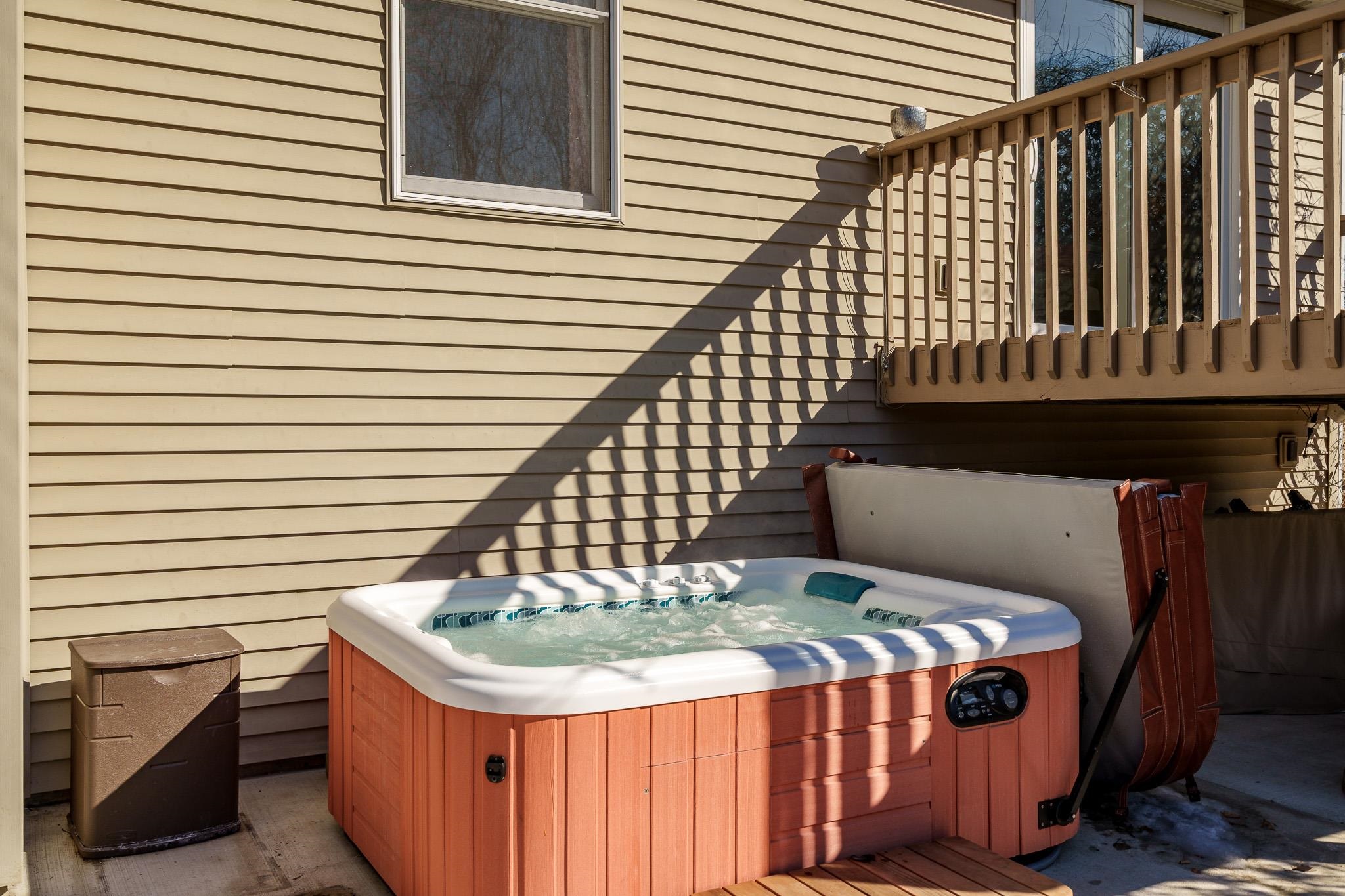 651 Genoa Street Cherry Valley, IL 61016 - Photo 56 of 70 a front view of a house with a garden