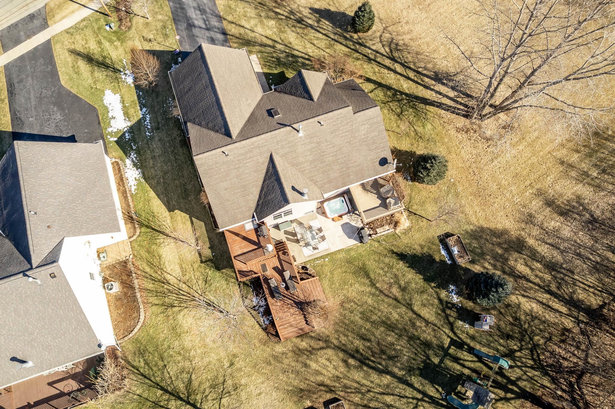 651 Genoa Street Cherry Valley, IL 61016 - Photo 6 of 70 an aerial view of a backyard with table and chairs